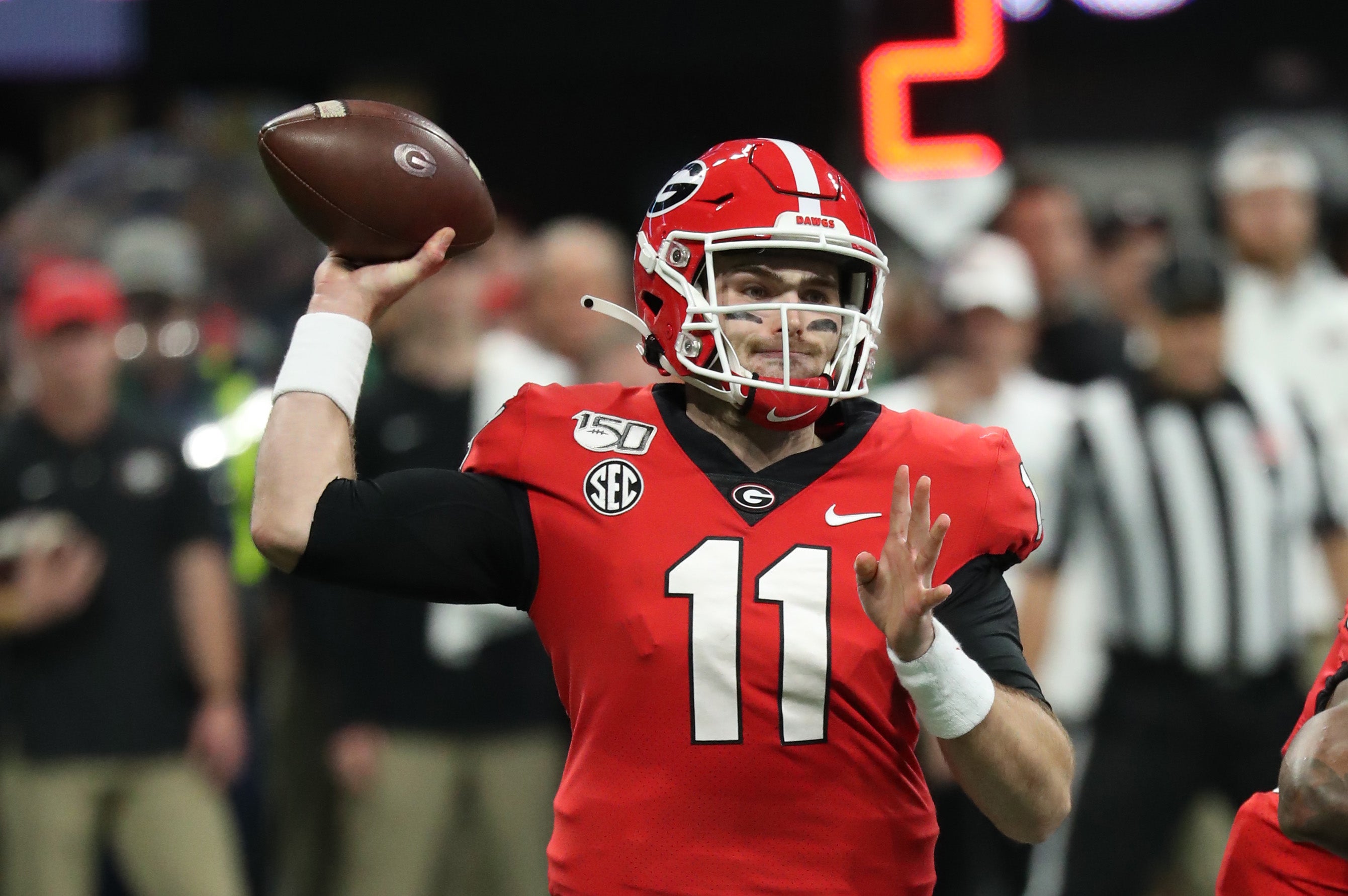 Georgia Bulldogs quarterback Jake Fromm (11) throws in the first quarter against the LSU Tigers at Mercedes-Benz Stadium.