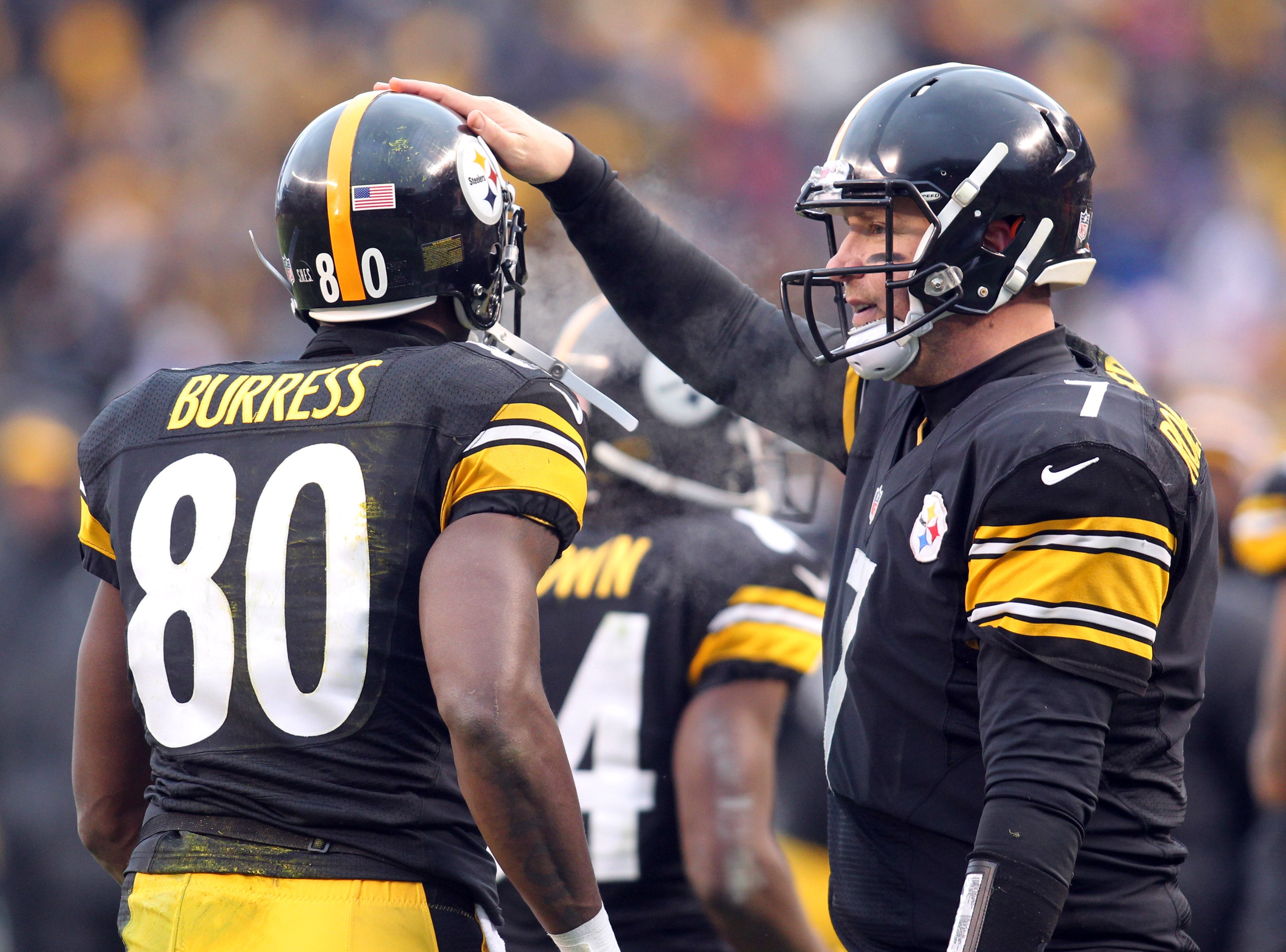 December 30, 2012; Pittsburgh, PA, USA; Pittsburgh Steelers wide receiver Plaxico Burress (80) is congratulated by quarterback Ben Roethlisberger (7) after the two combined for a touchdown against the Cleveland Browns during the fourth quarter at Heinz Field. The Pittsburgh Steelers won 24-10. Mandatory Credit: Charles LeClaire-USA TODAY Sports  