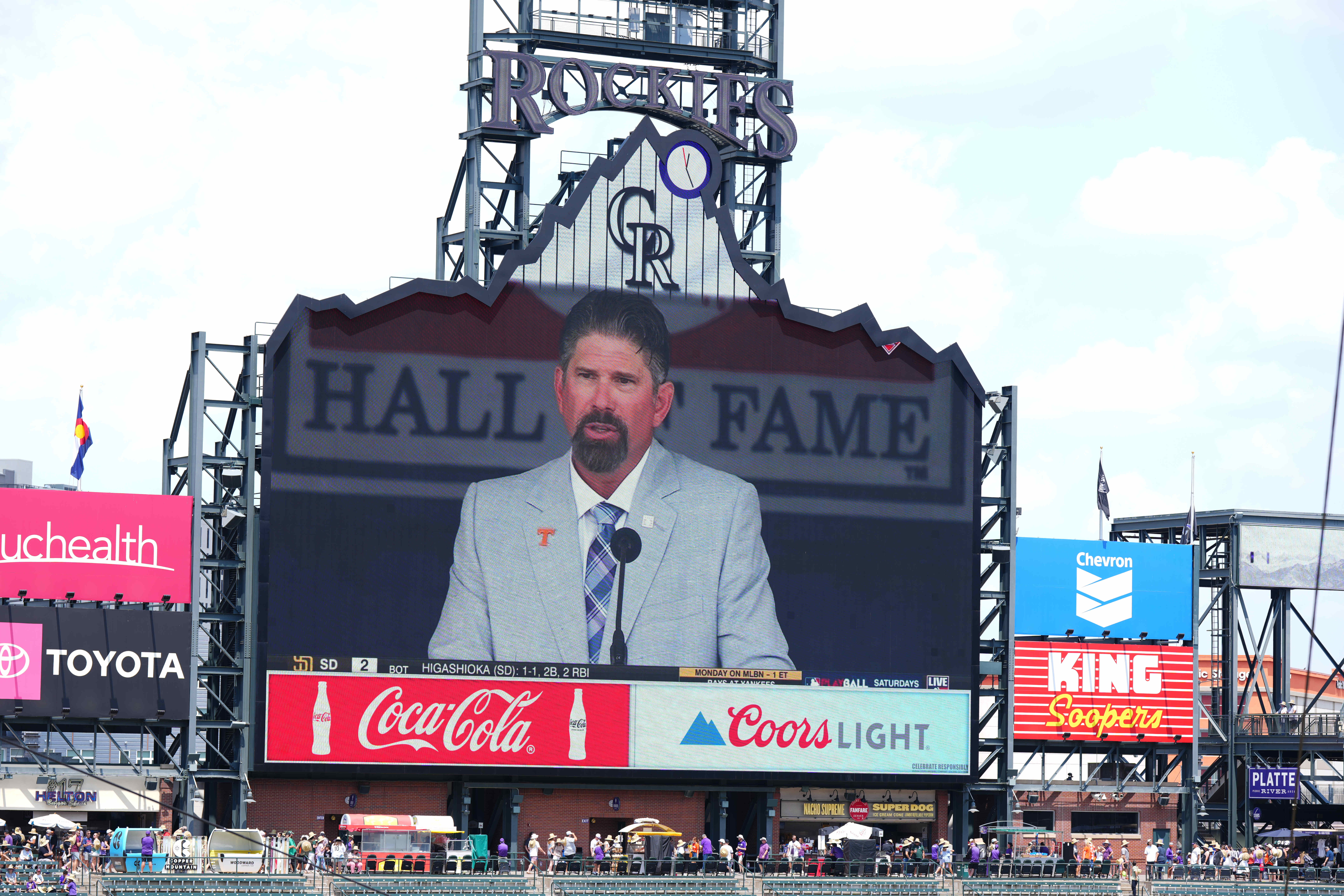 Jul 21, 2024; Denver, Colorado, USA; Hall of Fame Inductee Todd Helton speaks on Coors Field in-house stadium video system before the game between the Colorado Rockies and the San Francisco Giants.