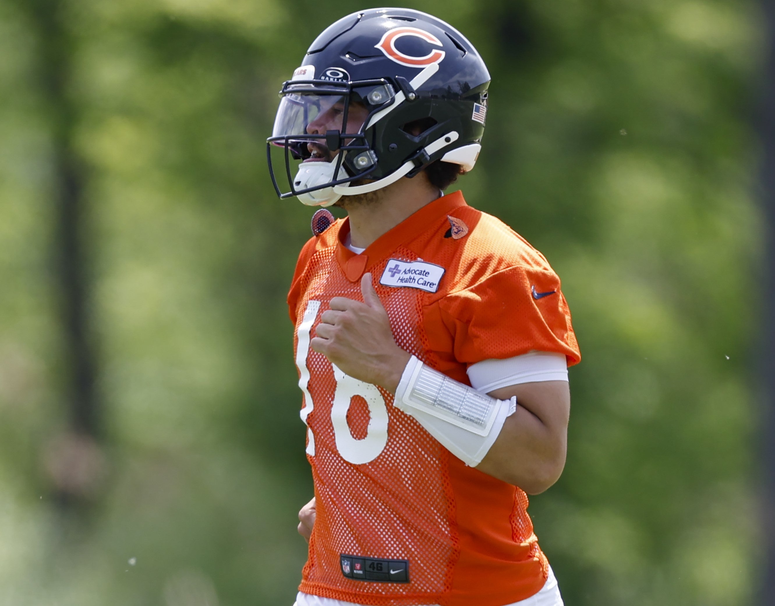 May 31, 2024; Lake Forest, IL, USA; Chicago Bears quarterback Caleb Williams (18) runs on the field during organized team activities at Halas Hall.