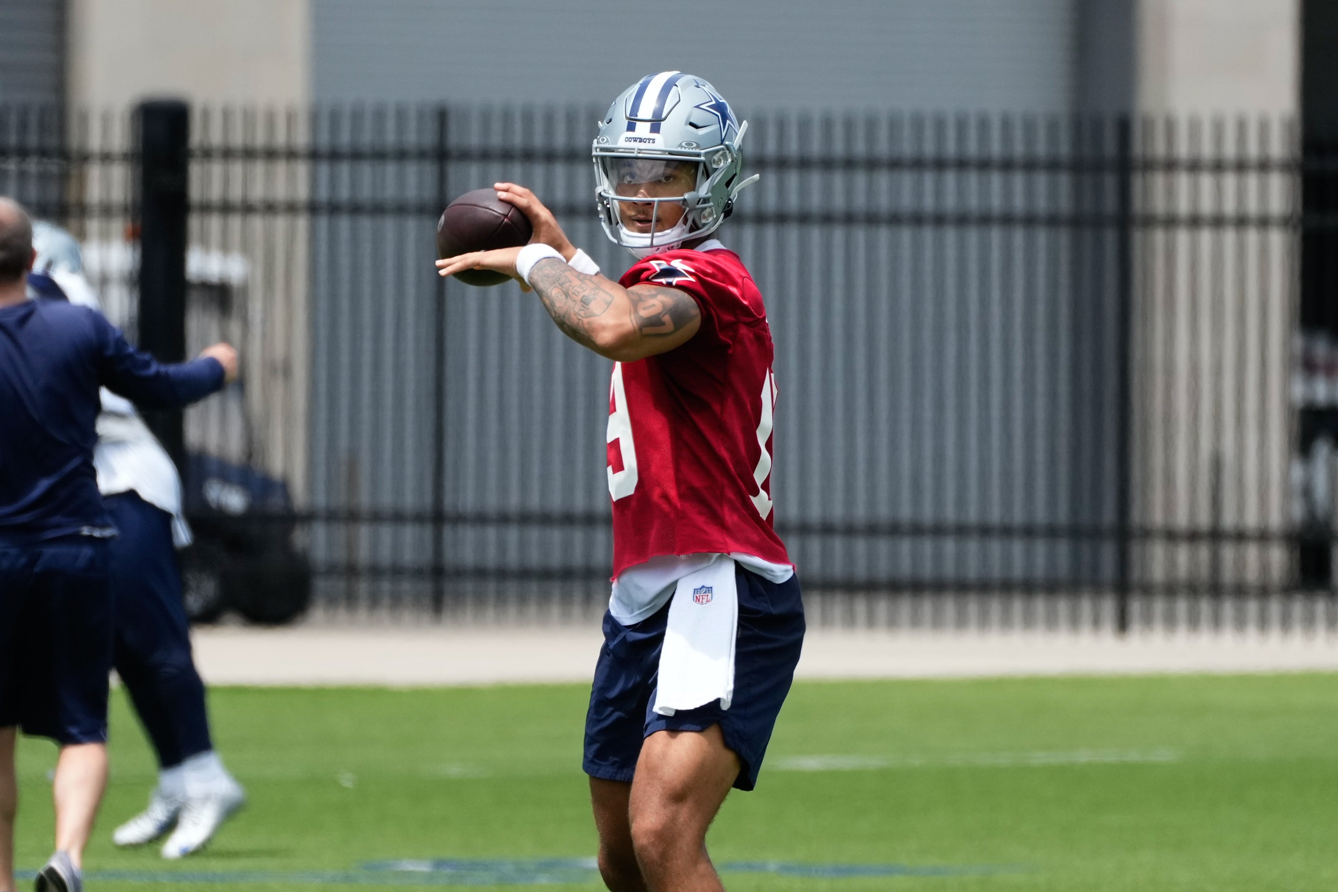 Dallas Cowboys quarterback Trey Lance (19) goes through a drill during practice at the Ford Center at the Star Training Facility in Frisco, Texas.