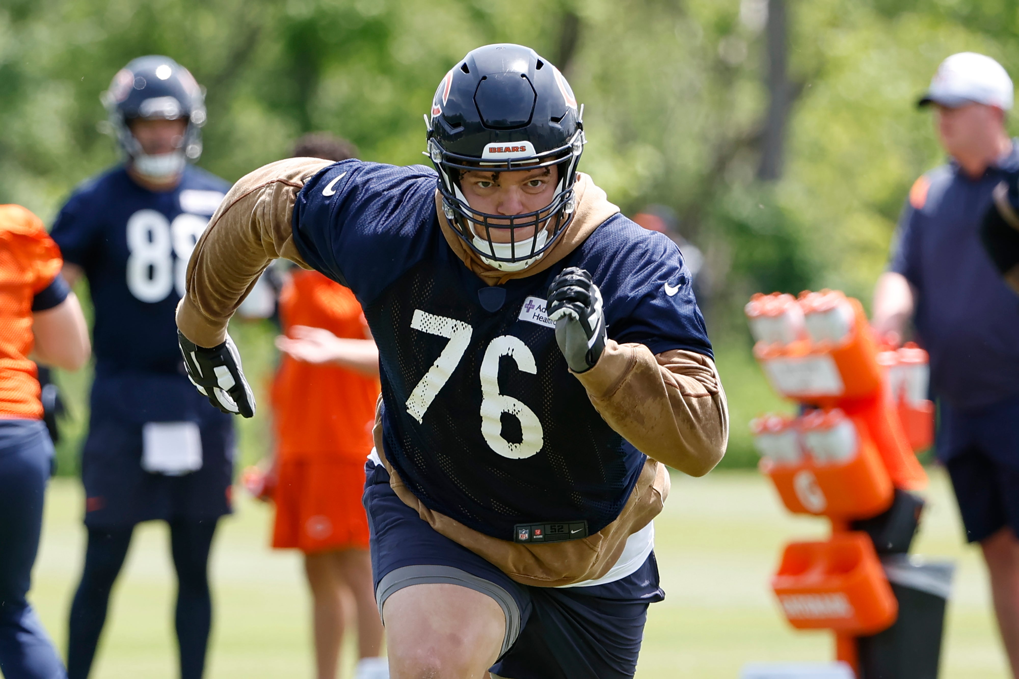 May 31, 2024; Lake Forest, IL, USA; Chicago Bears offensive tackle Teven Jenkins (76) runs during organized team activities at Halas Hall.