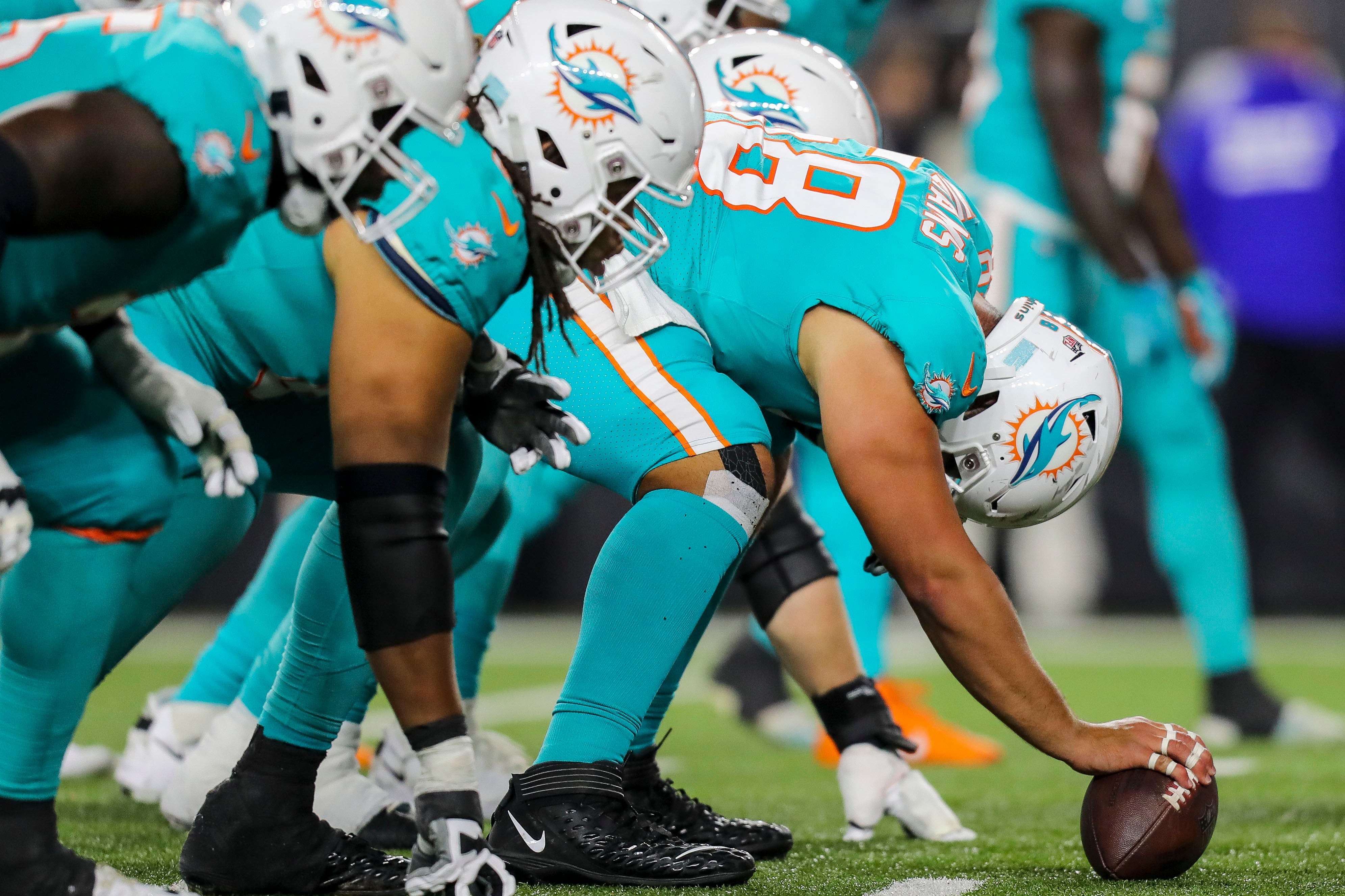 Sep 29, 2022; Cincinnati, Ohio, USA; Miami Dolphins guard Connor Williams (58) snaps the ball in the second half against the Cincinnati Bengals at Paycor Stadium.
