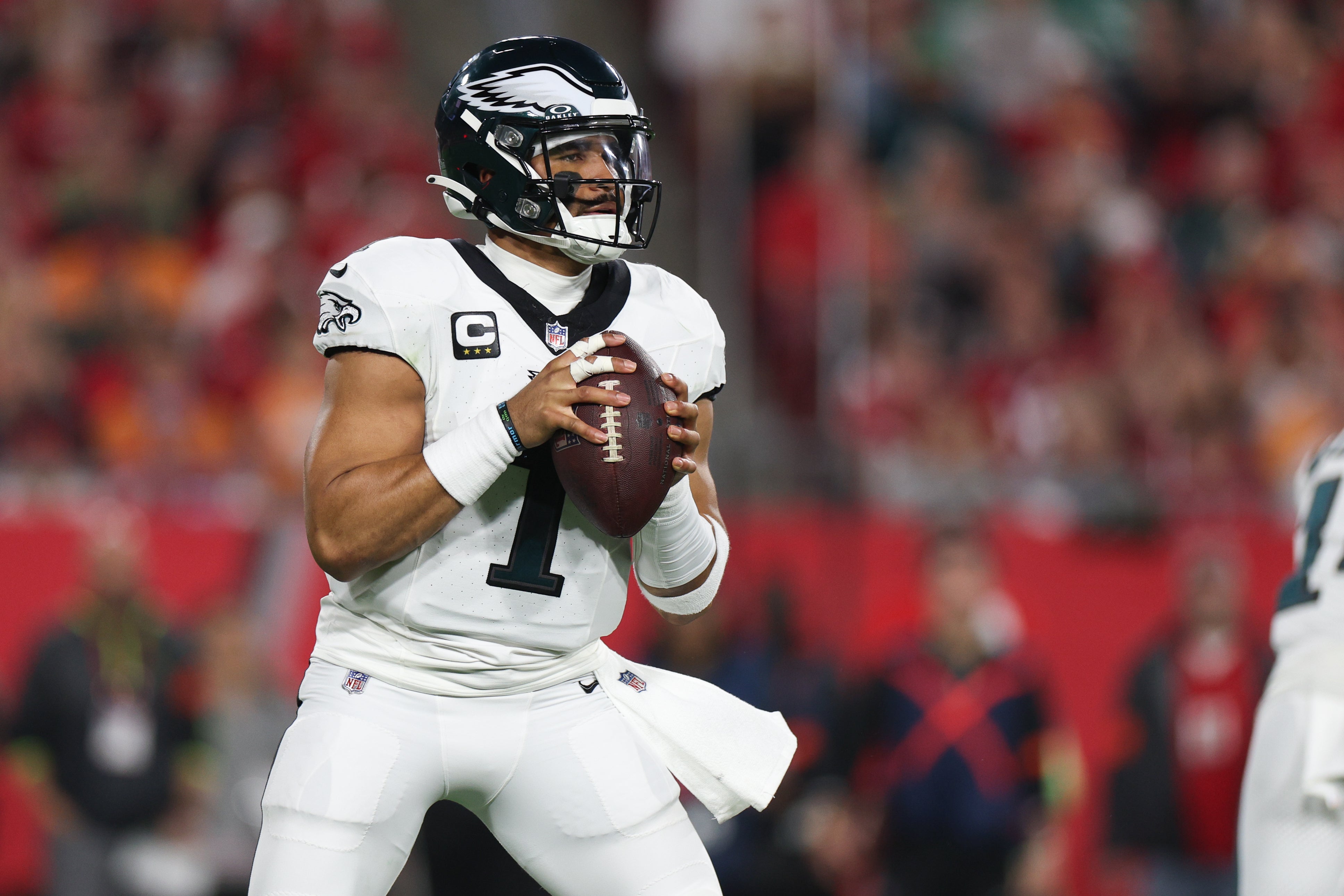Philadelphia Eagles quarterback Jalen Hurts (1) looks to throw against the Tampa Bay Buccaneers during the second half of a 2024 NFC wild card game at Raymond James Stadium.