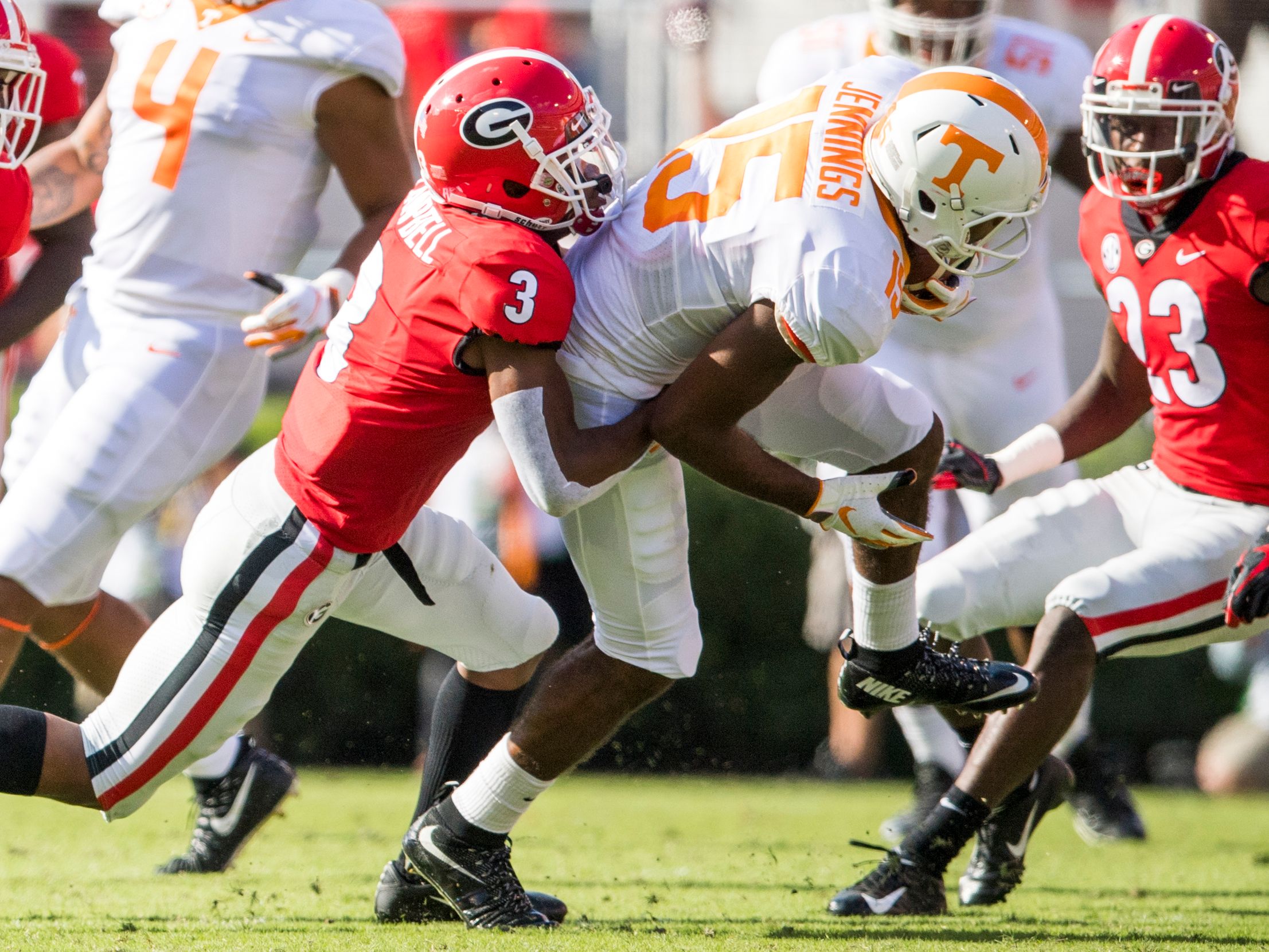 Tennessee wide receiver Jauan Jennings (15) drags Georgia defensive back Tyson Campbell (3) as Jennings fights for extra yards during the Tennessee Volunteers' game against Georgia in Sanford Stadium.