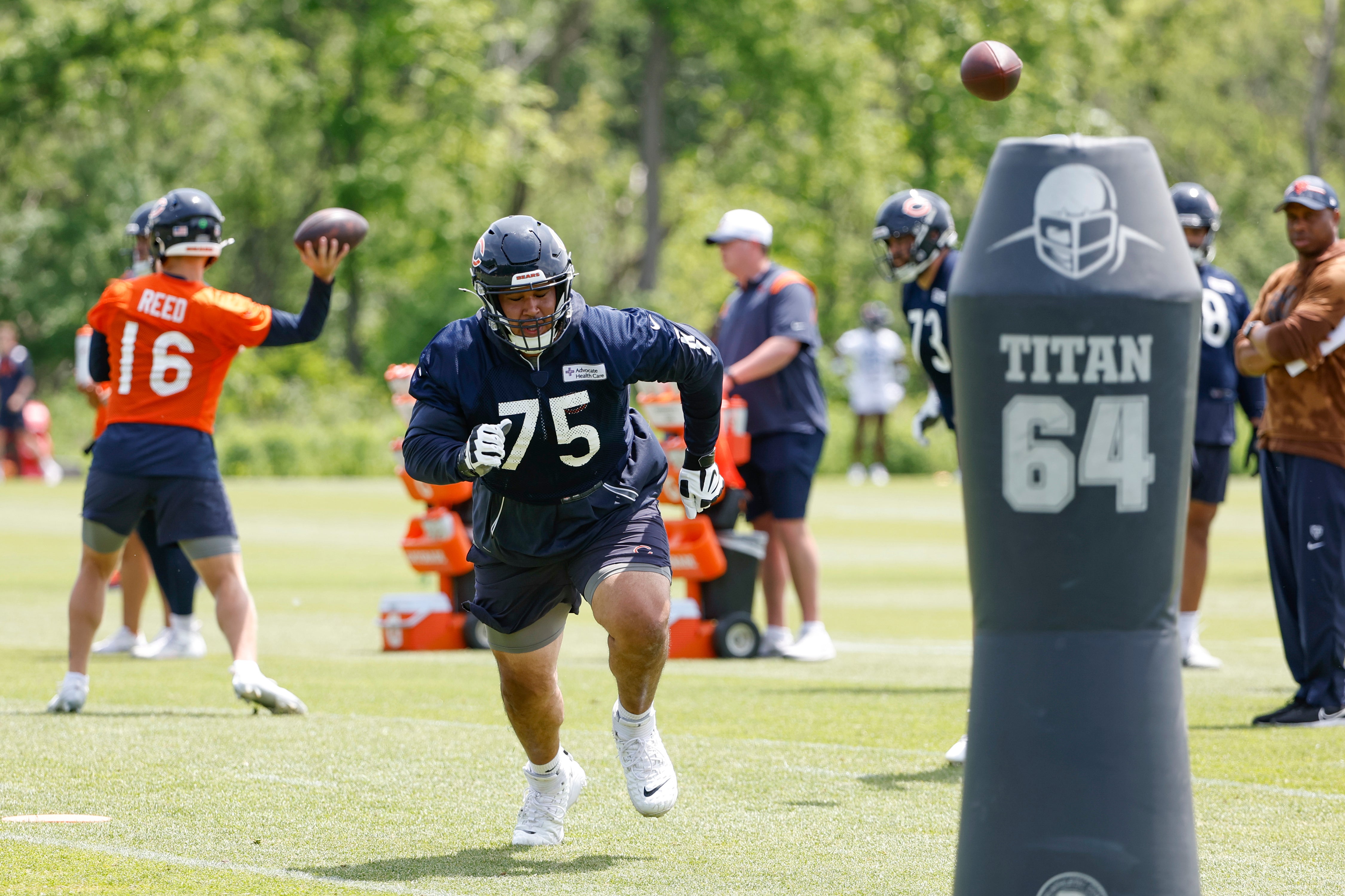 May 31, 2024; Lake Forest, IL, USA; Chicago Bears offensive tackle Larry Borom (75) runs during organized team activities at Halas Hall.