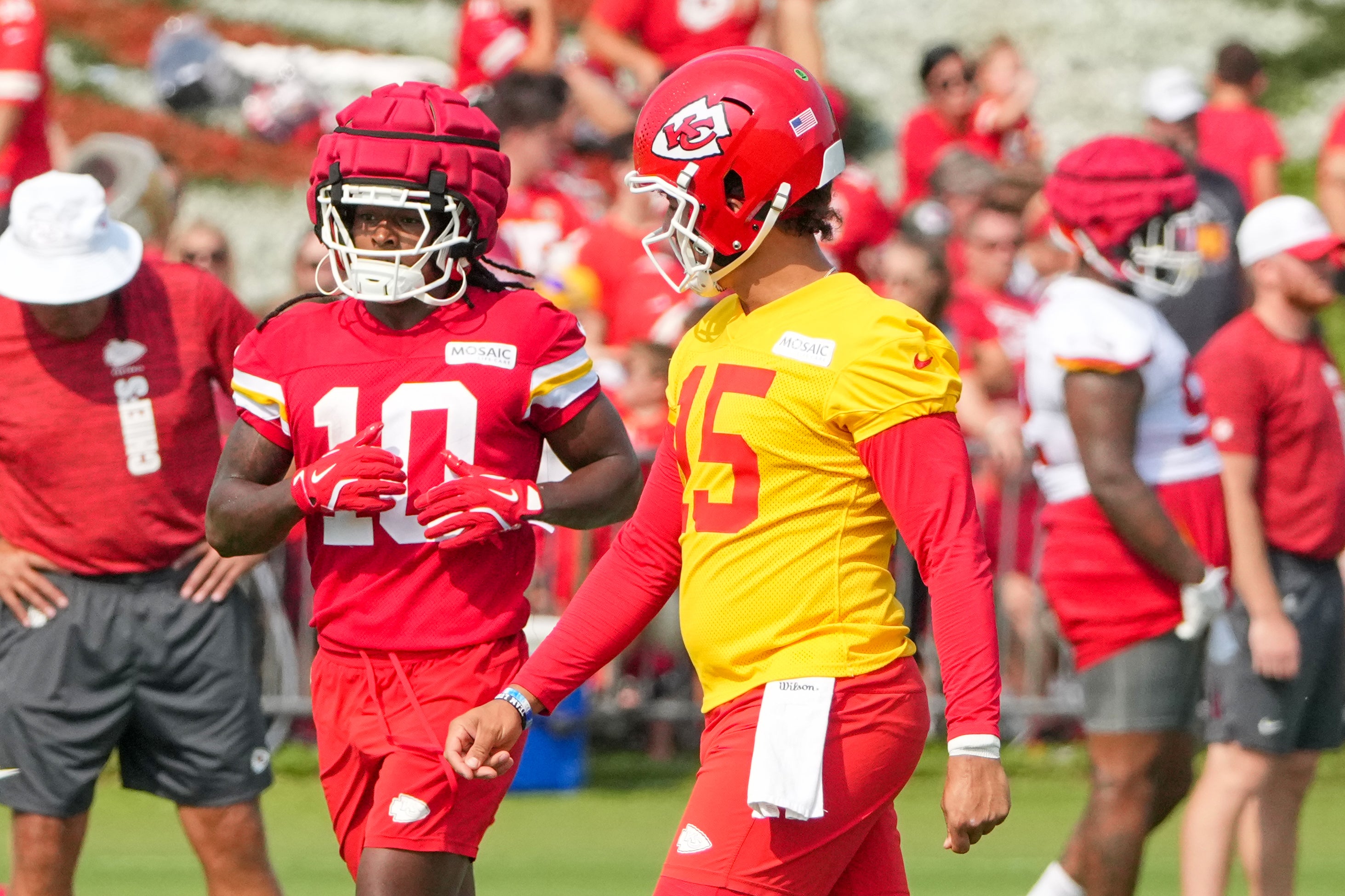 Jul 22, 2024; St. Joseph, MO, USA; Kansas City Chiefs running back Isiah Pacheco (10) and quarterback Patrick Mahomes (15) walk to the line during training camp at Missouri Western State University.