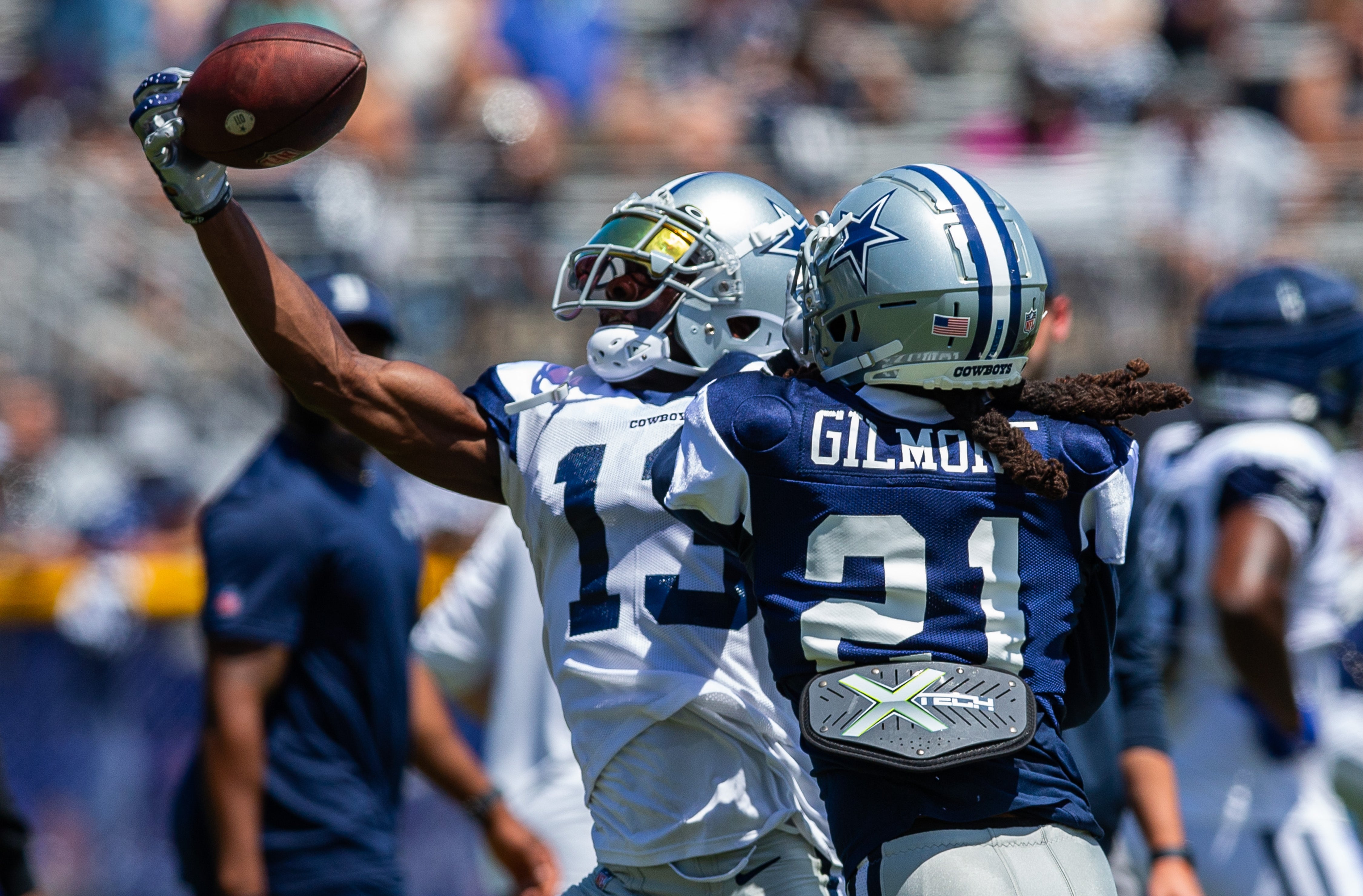 Dallas Cowboys wide receiver Michael Gallup (13) makes a catch against cornerback Stephon Gilmore (21) during training camp at Marriott Residence Inn-River Ridge playing fields.