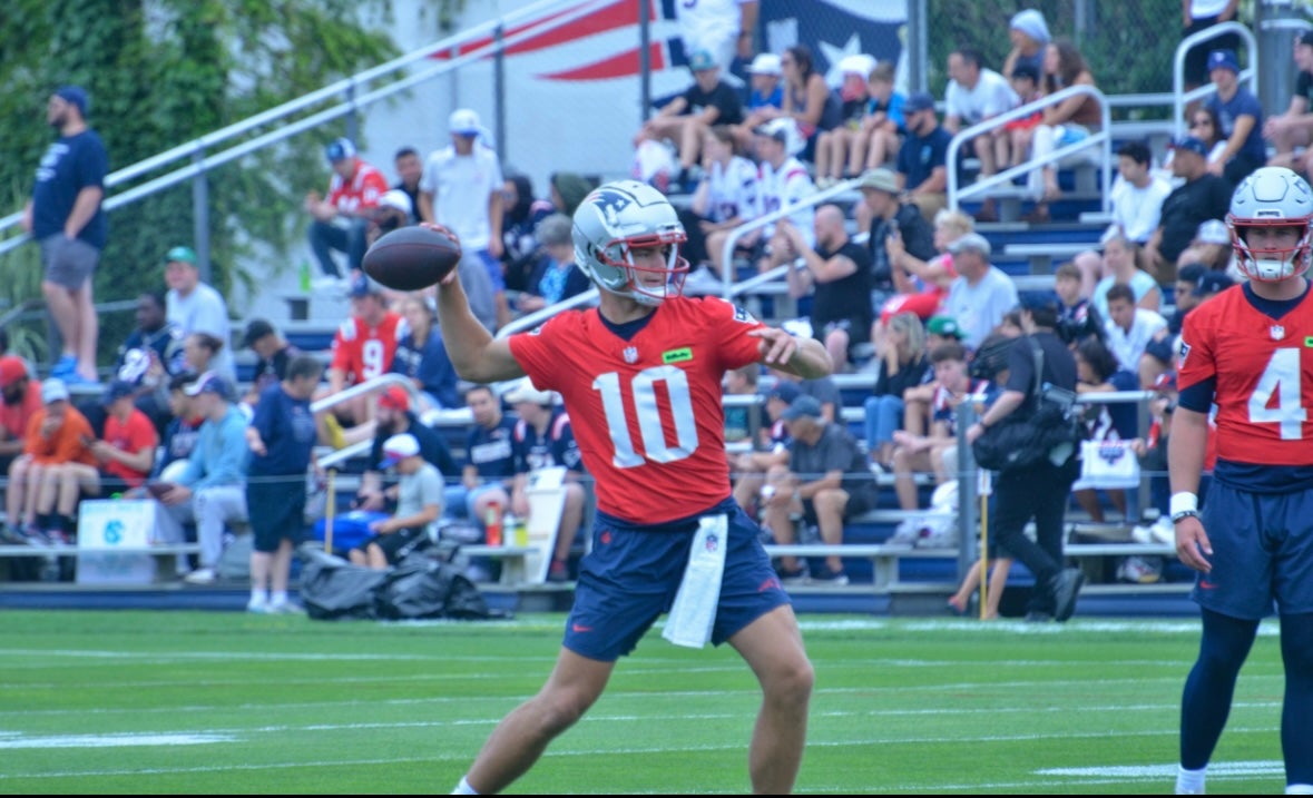 Drake Maye throws the ball during the first day of training camp - July 24, 2024