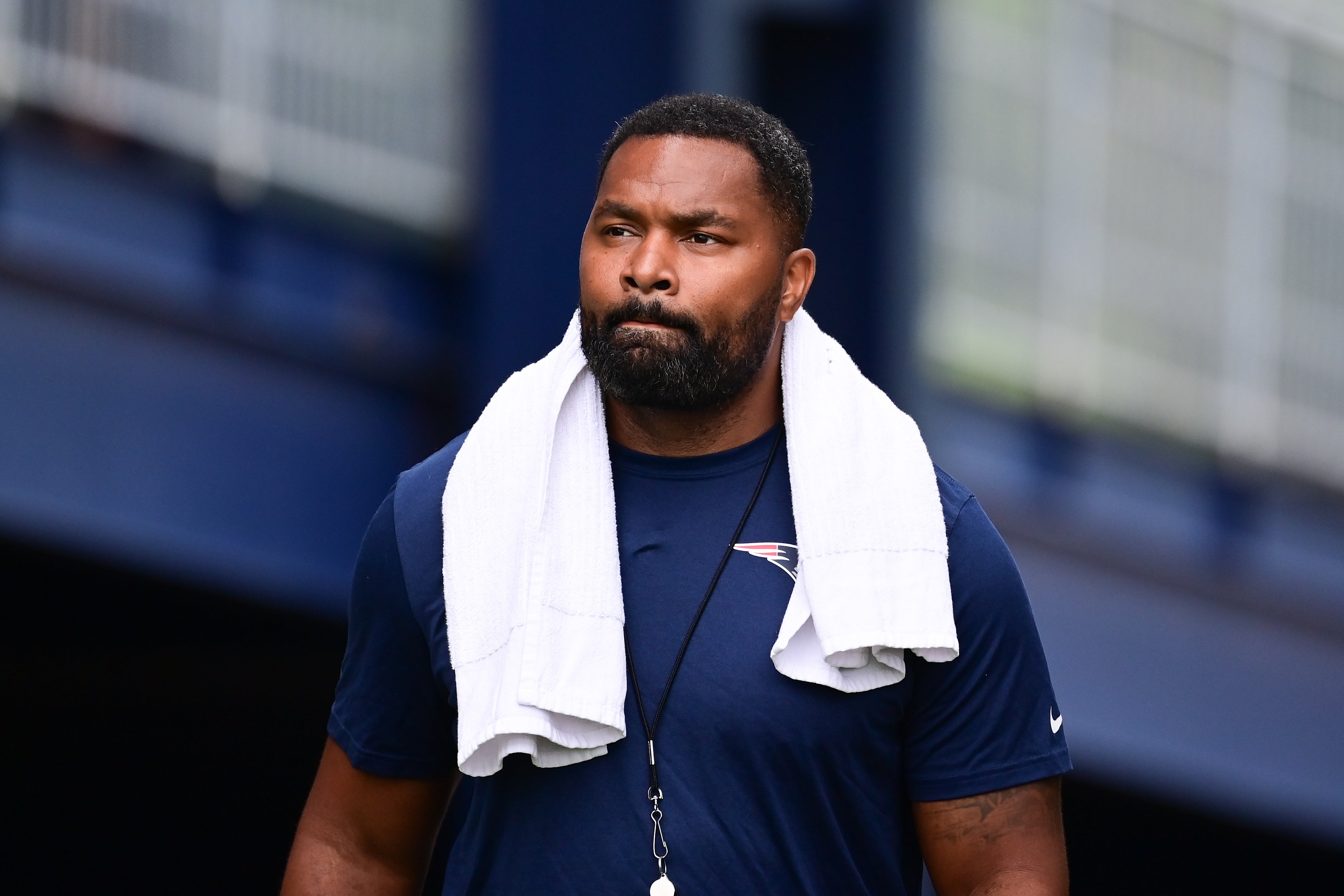 Jul 24, 2024; Foxborough, MA, USA; New England Patriots head coach Jerod Mayo walks to the podium for a press conference before training camp at Gillette Stadium. 