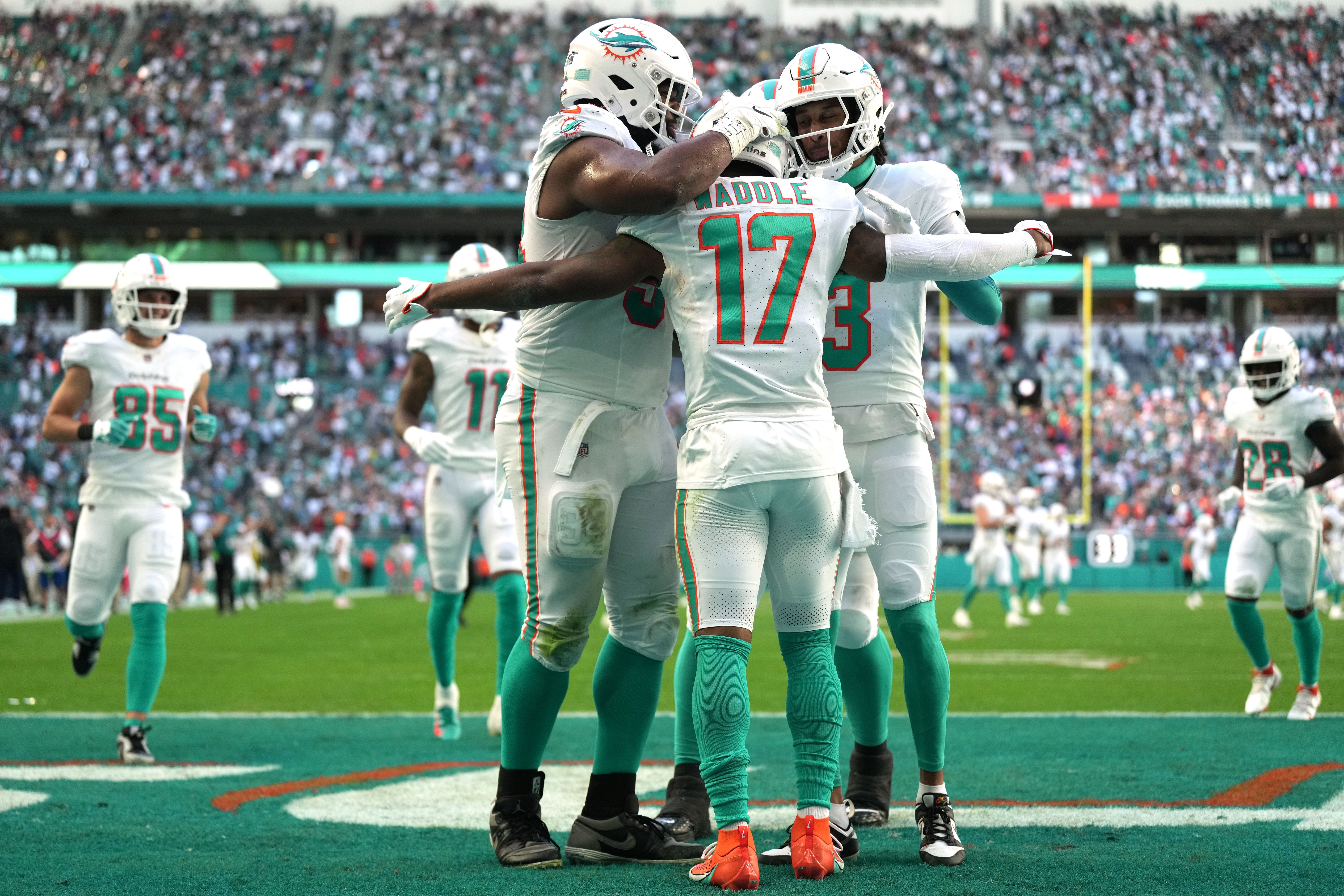 Miami Dolphins wide receiver Jaylen Waddle (17) celebrates a touchdown against the New York Jets with teammates during the first half of an NFL game at Hard Rock Stadium in Miami Gardens, Dec. 17, 2023.