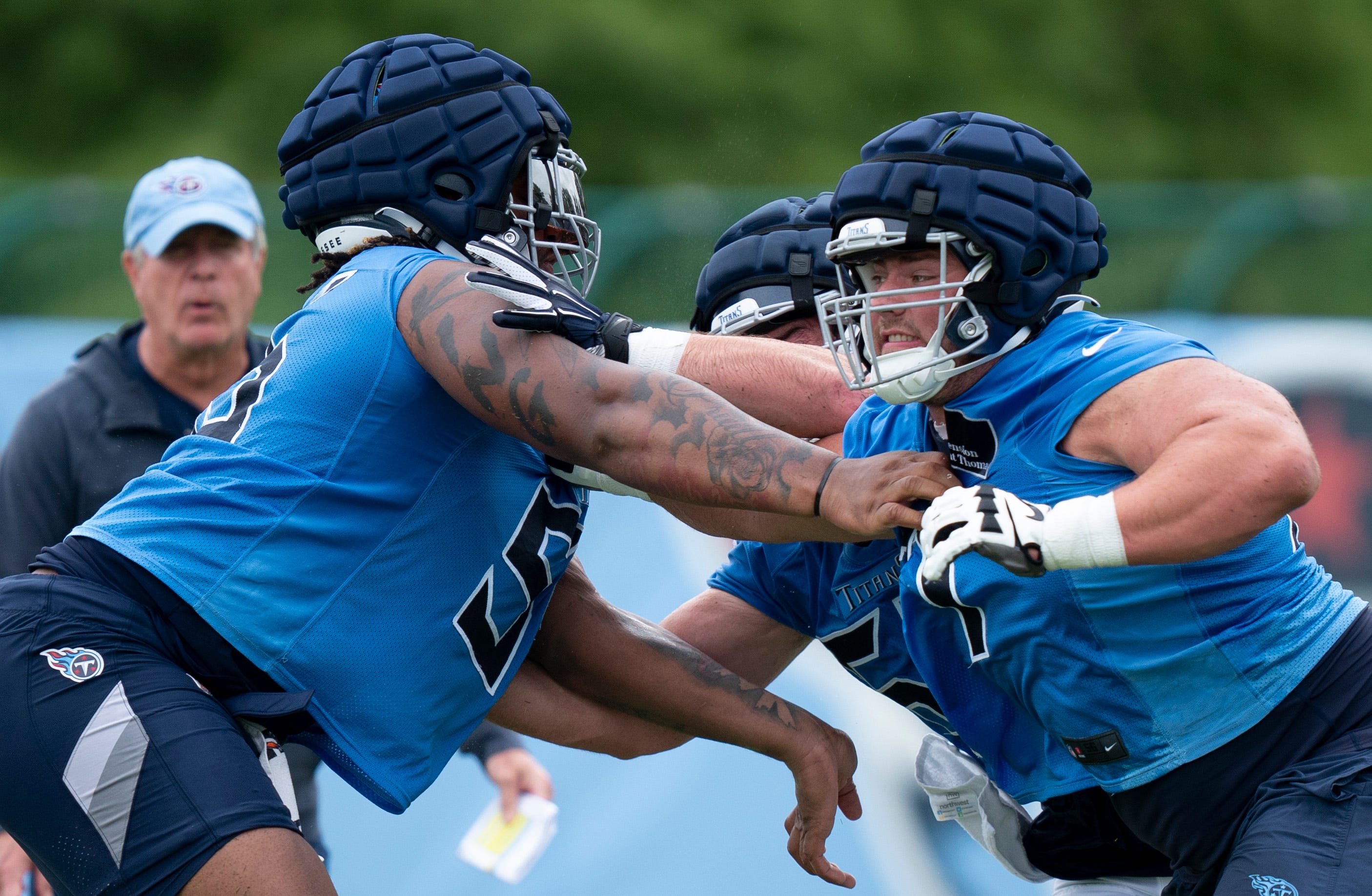 Tennessee Titans offensive linemen JC Latham (55) and Peter Skoronski (77) run drills on the second day of training camp Thursday, July 25, 2024 Denny Simmons/The Tennessean-USA TODAY NETWORK
