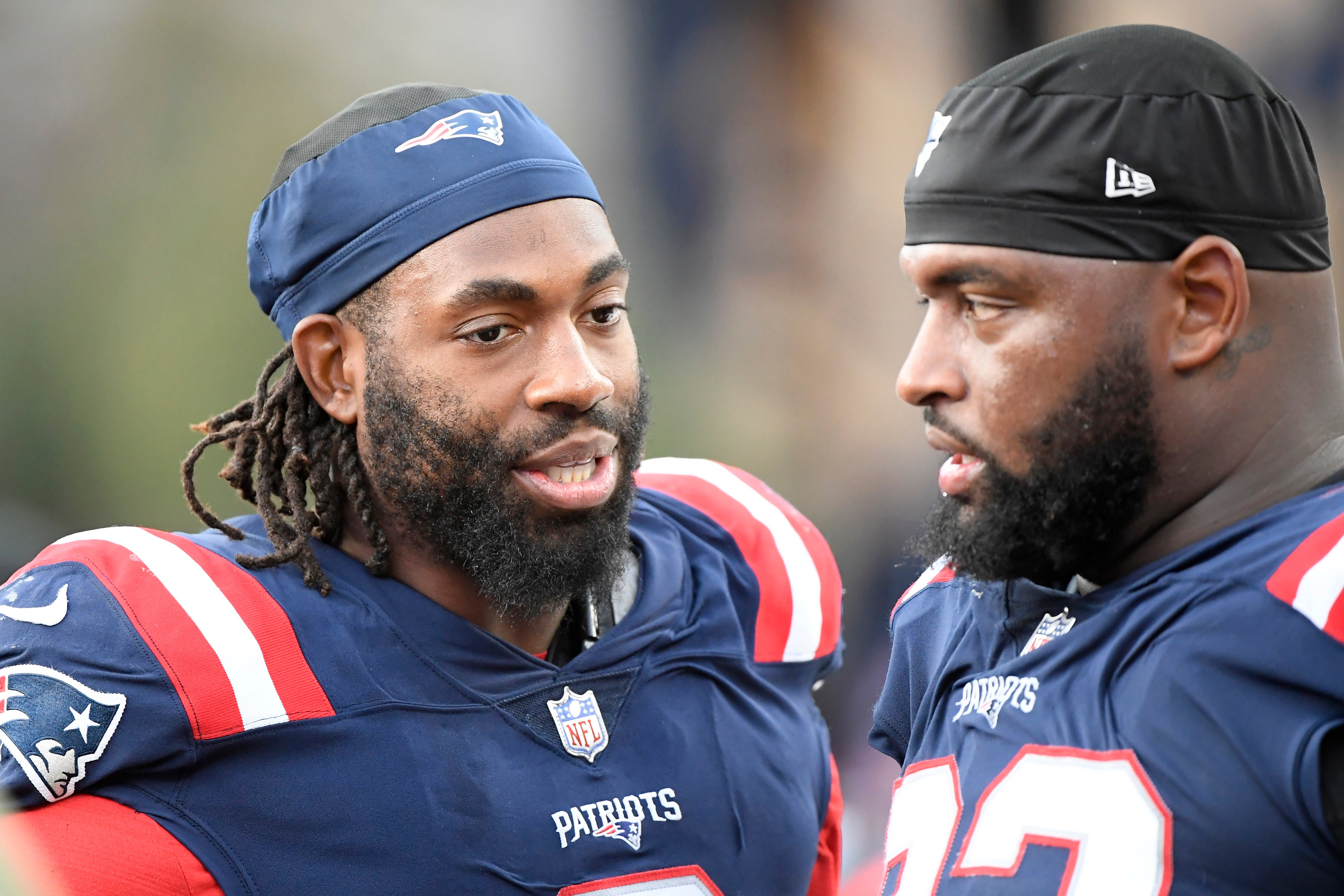 Nov 6, 2022; Foxborough, Massachusetts, USA; New England Patriots linebacker Matthew Judon (9) talks with defensive tackle Davon Godchaux (92) during the second half against the Indianapolis Colts at Gillette Stadium. 