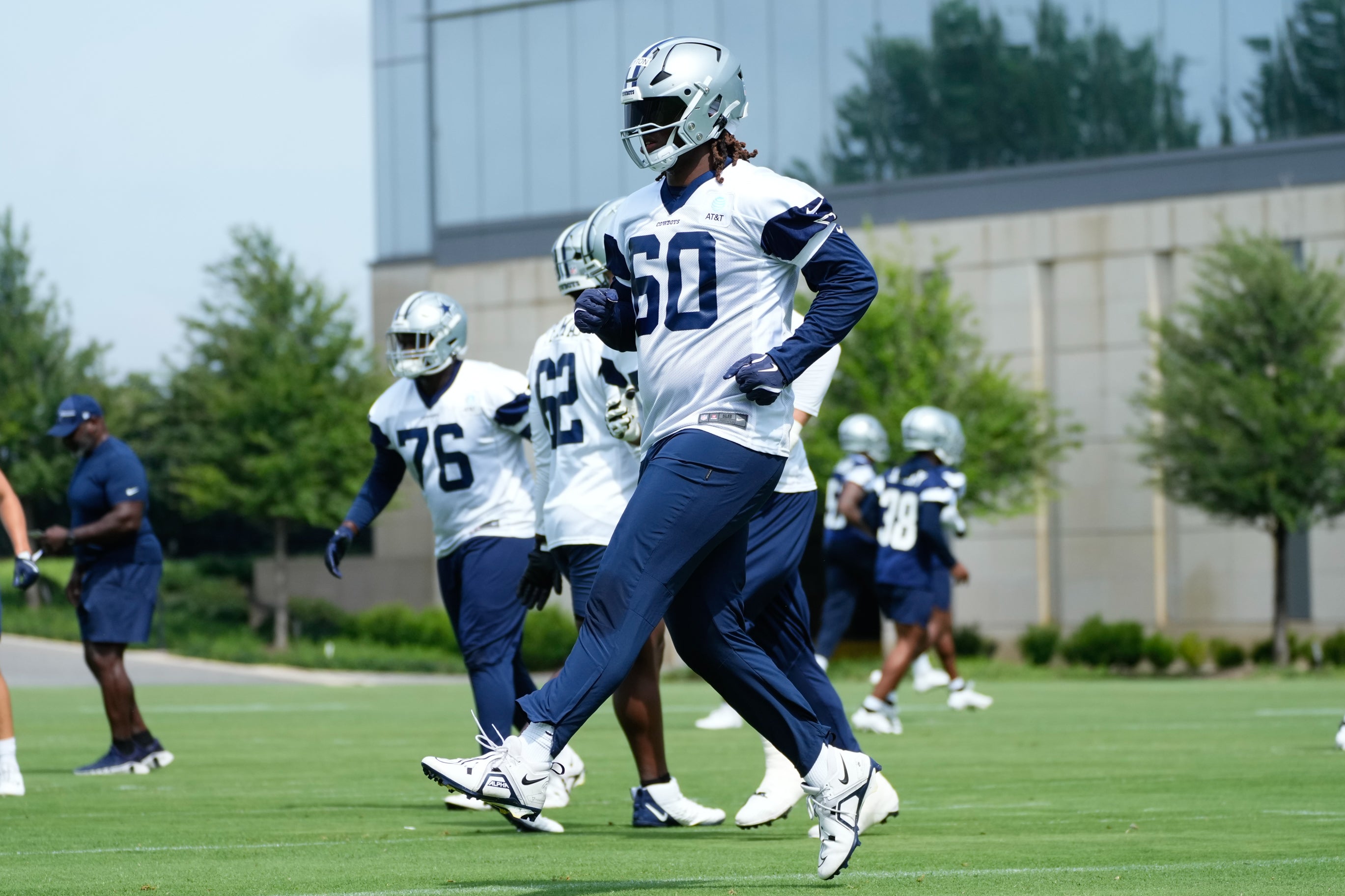 Dallas Cowboys tackle Tyler Guyton (60) goes through a drill during practice at the Ford Center at the Star Training Facility in Frisco, Texas.