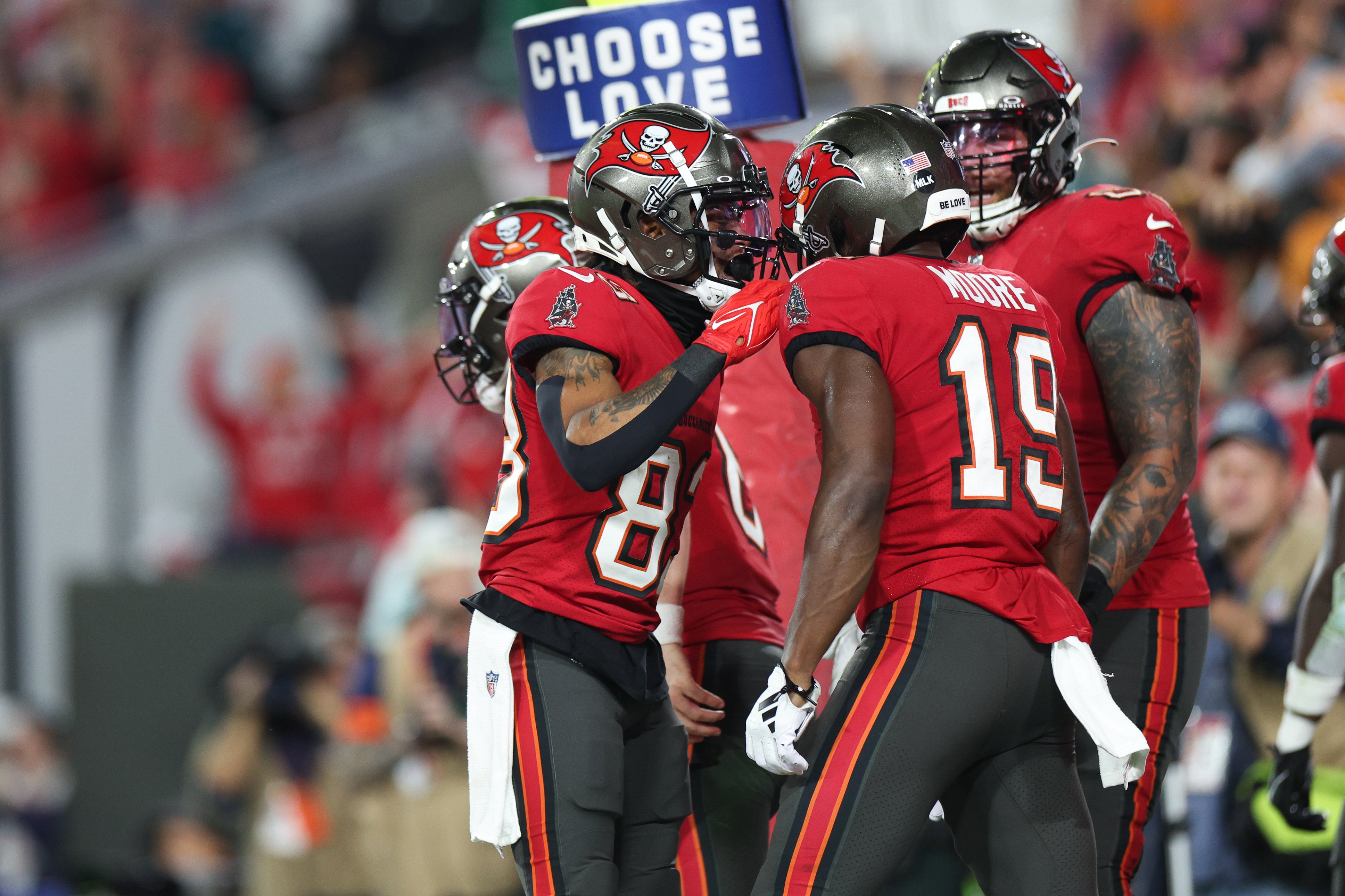 Jan 15, 2024; Tampa, Florida, USA; Tampa Bay Buccaneers wide receiver David Moore (19) celebrates his touchdown with wide receiver Deven Thompkins (83) during the first half of a 2024 NFC wild card game against the Philadelphia Eagles at Raymond James Stadium. Mandatory Credit: Nathan Ray Seebeck-USA TODAY Sports
