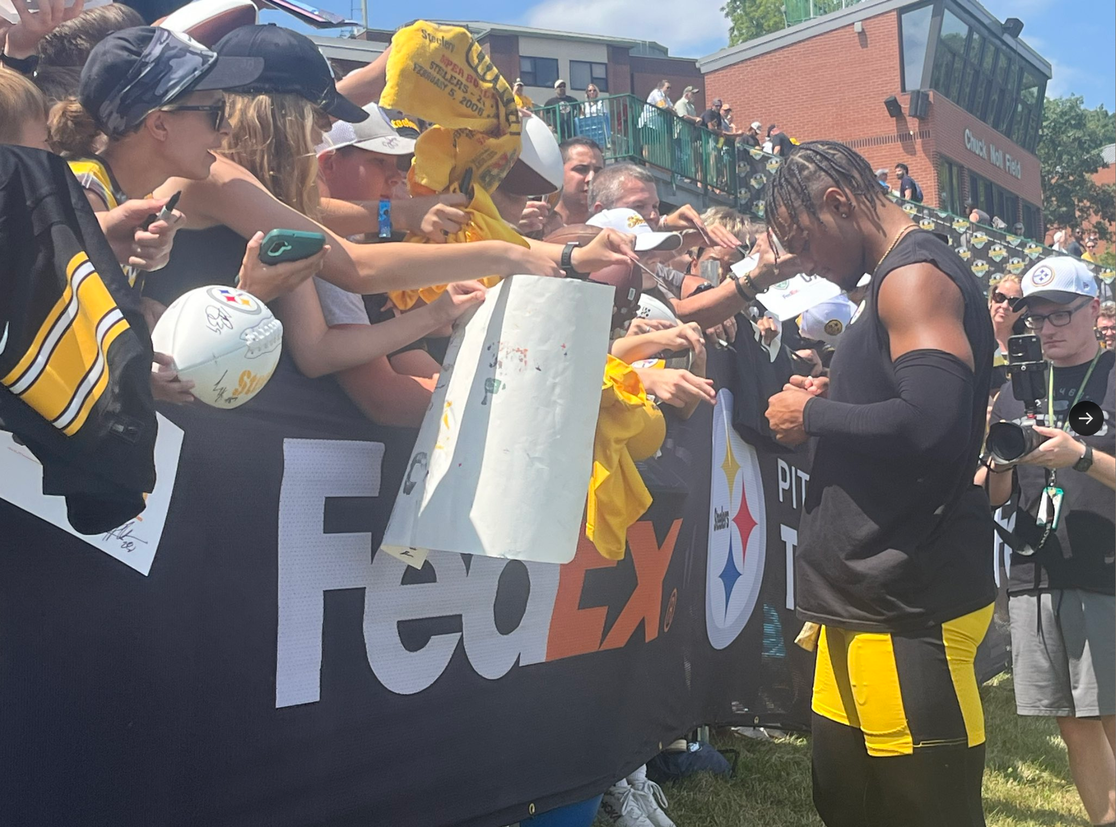 Justin Fields signs autographs after day two of Pittsburgh Steelers 2024 training camp at Saint Vincent College in Latrobe, Pennsylvania. 7/26/24