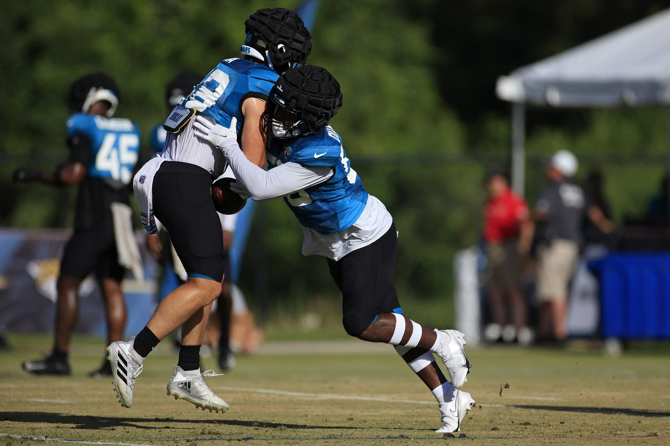 Jacksonville Jaguars linebacker Shaquille Quarterman, right, defends against Jacksonville Jaguars linebacker Chad Muma (48) during day 7 of the Jaguars Training Camp Sunday, July 31, 2022 at the Knight Sports Complex at Episcopal School of Jacksonville.