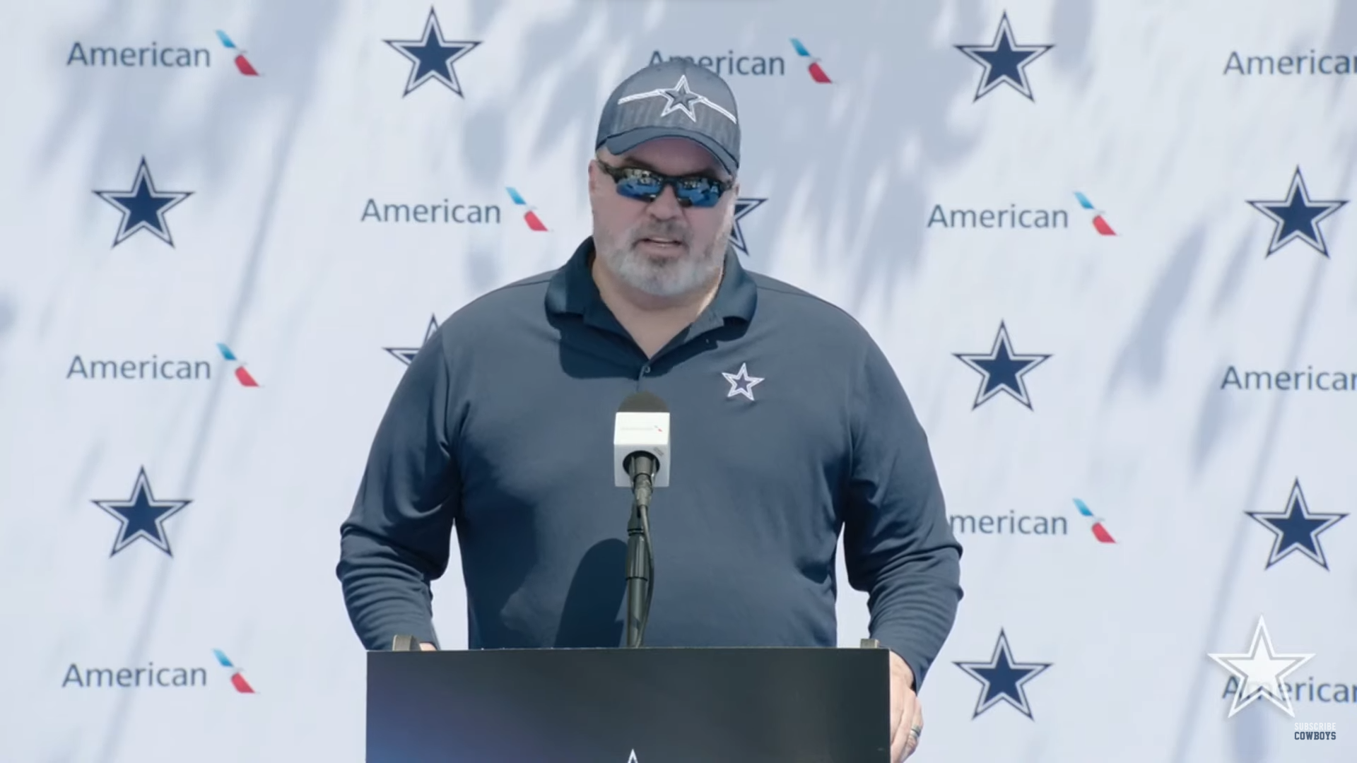 Dallas Cowboys head coach Mike McCarthy talks to reporters at 2024 training camp.