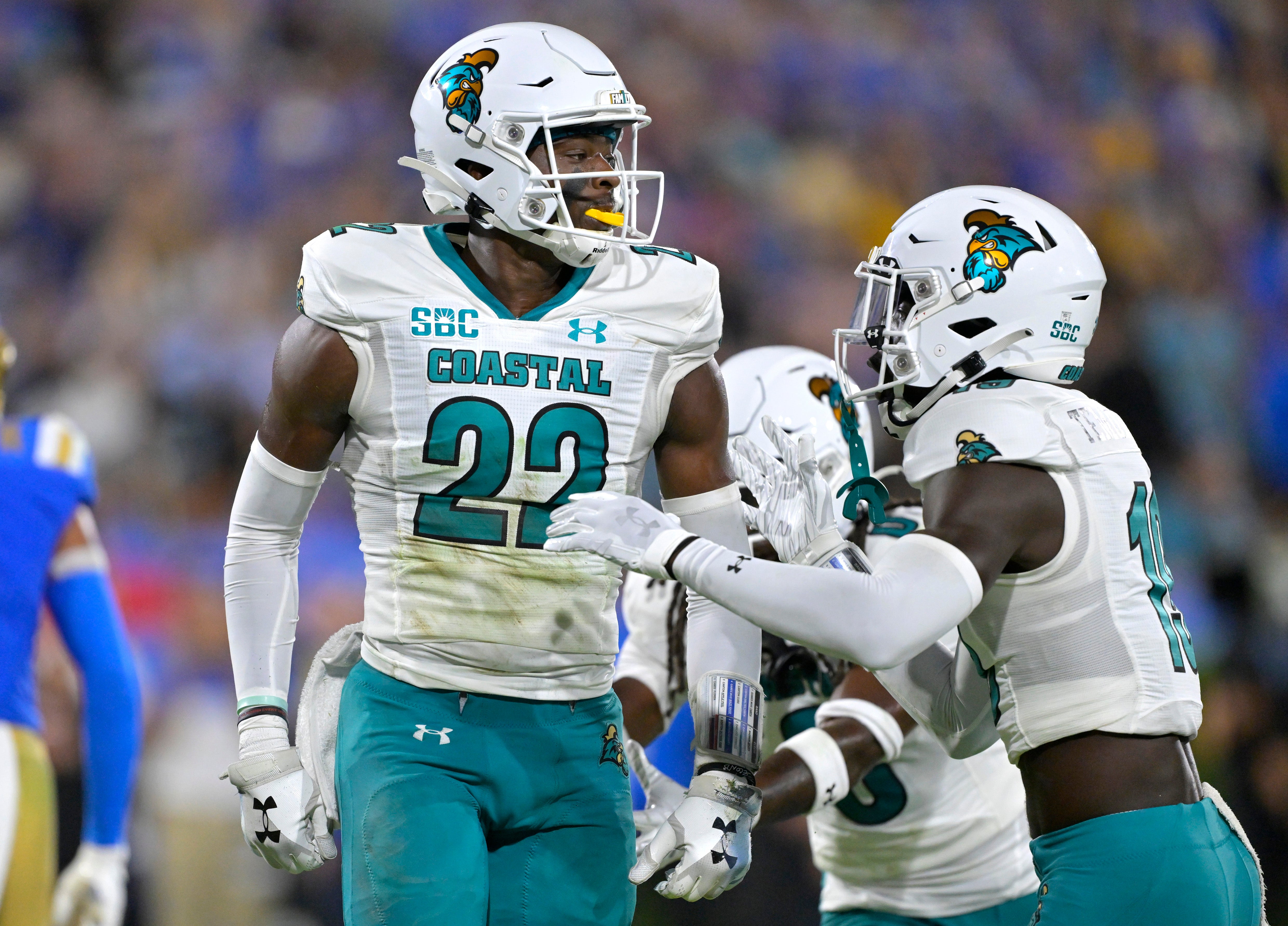 Sep 2, 2023; Pasadena, California, USA; Coastal Carolina Chanticleers safety Clayton Isbell (22) celebrates after an interception in the end zone in the first half against the UCLA Bruins at Rose Bowl.