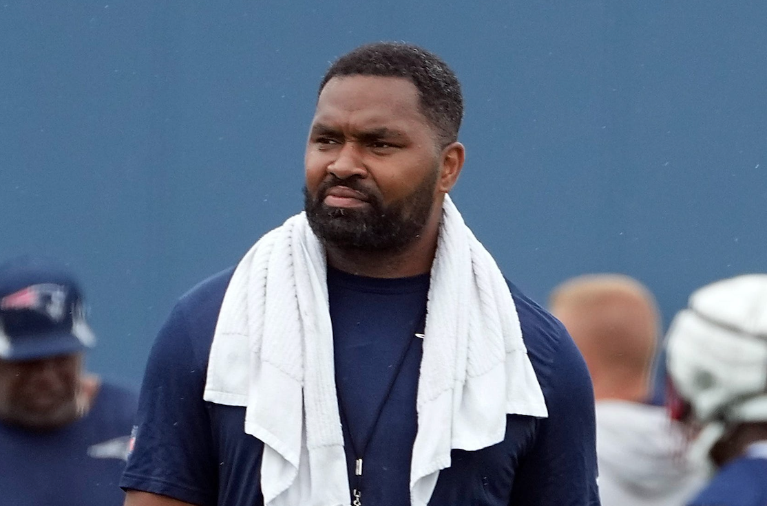 Patriots head coach Jerod Mayo looks over his team as he moves across the practice fields.