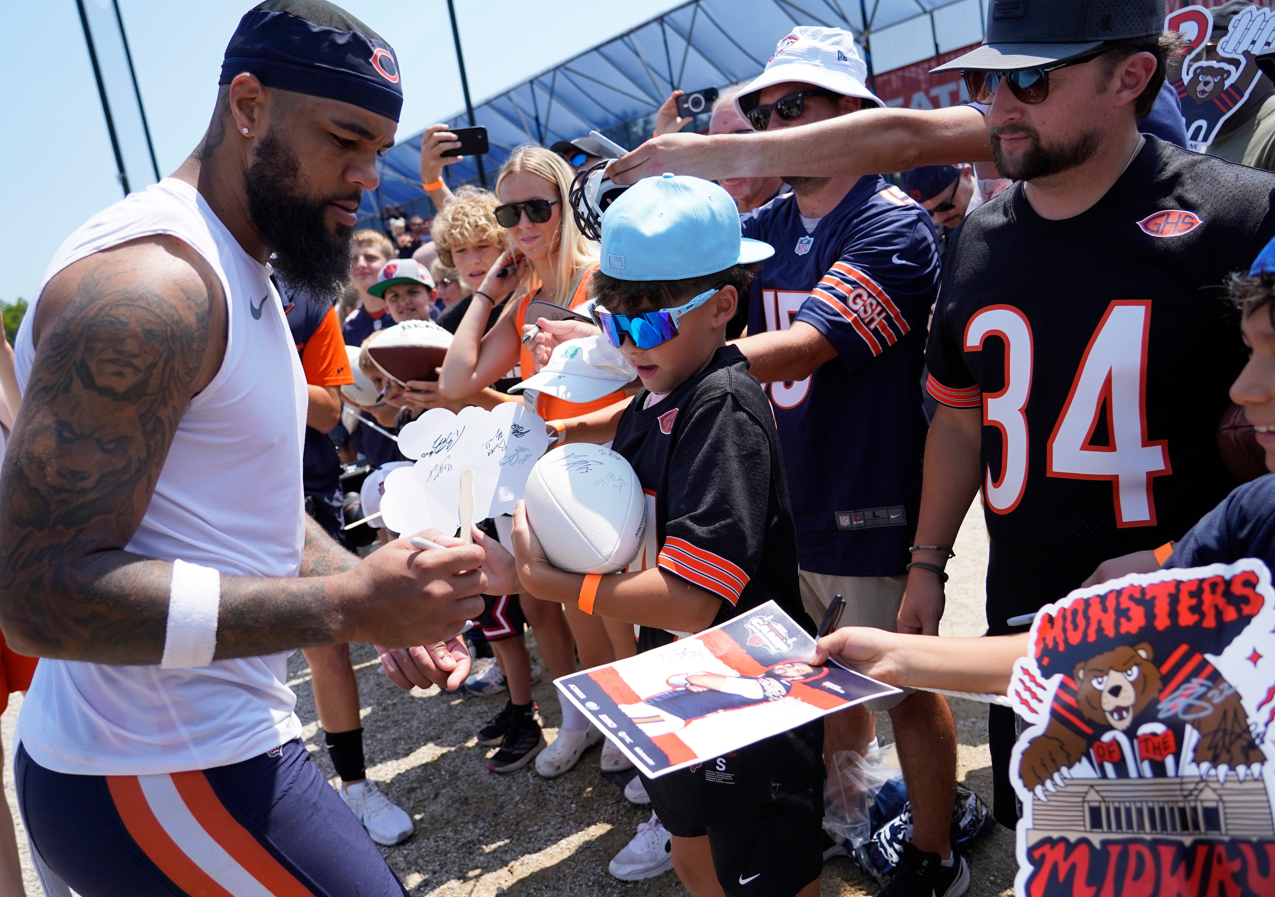Jul 27, 2024; Lake Forest, IL, USA; Chicago Bears wide receiver Keenan Allen (13) signs autographs during Chicago Bears Training Camp at Halas Hall.