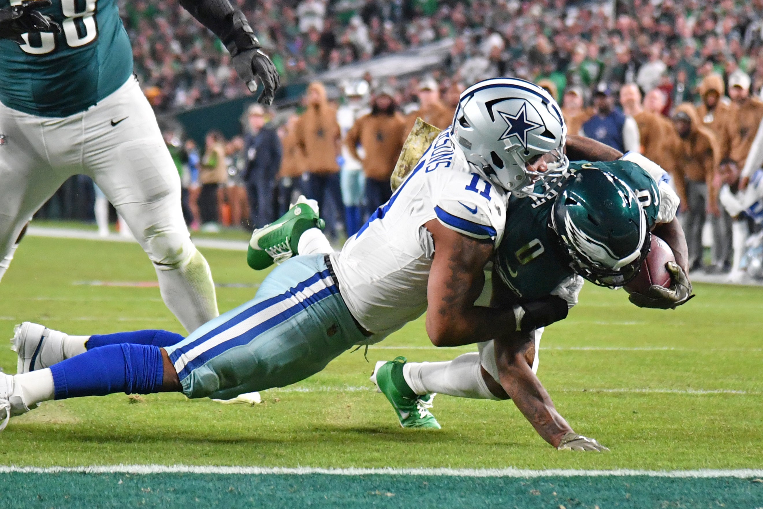 Dallas Cowboys linebacker Micah Parsons (11) stops Philadelphia Eagles running back D'Andre Swift (0) short of the goal line during the second quarter at Lincoln Financial Field.