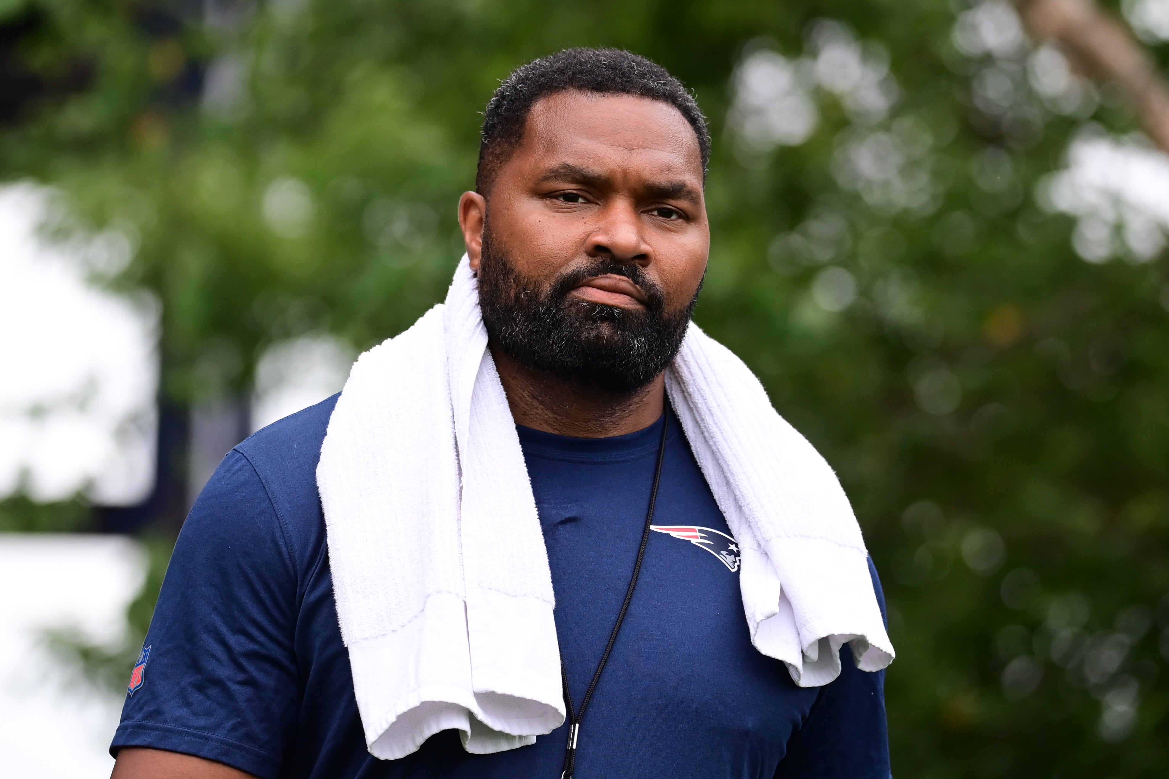 Jul 24, 2024; Foxborough, MA, USA; New England Patriots head coach Jerod Mayo walks to the podium for a press conference before training camp at Gillette Stadium.