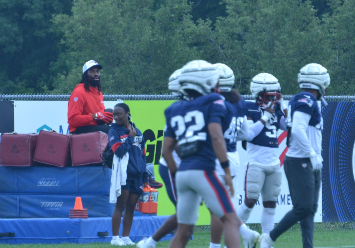 Patriots LB Matthew Judon sits on the side during practice amid contract uncertainty