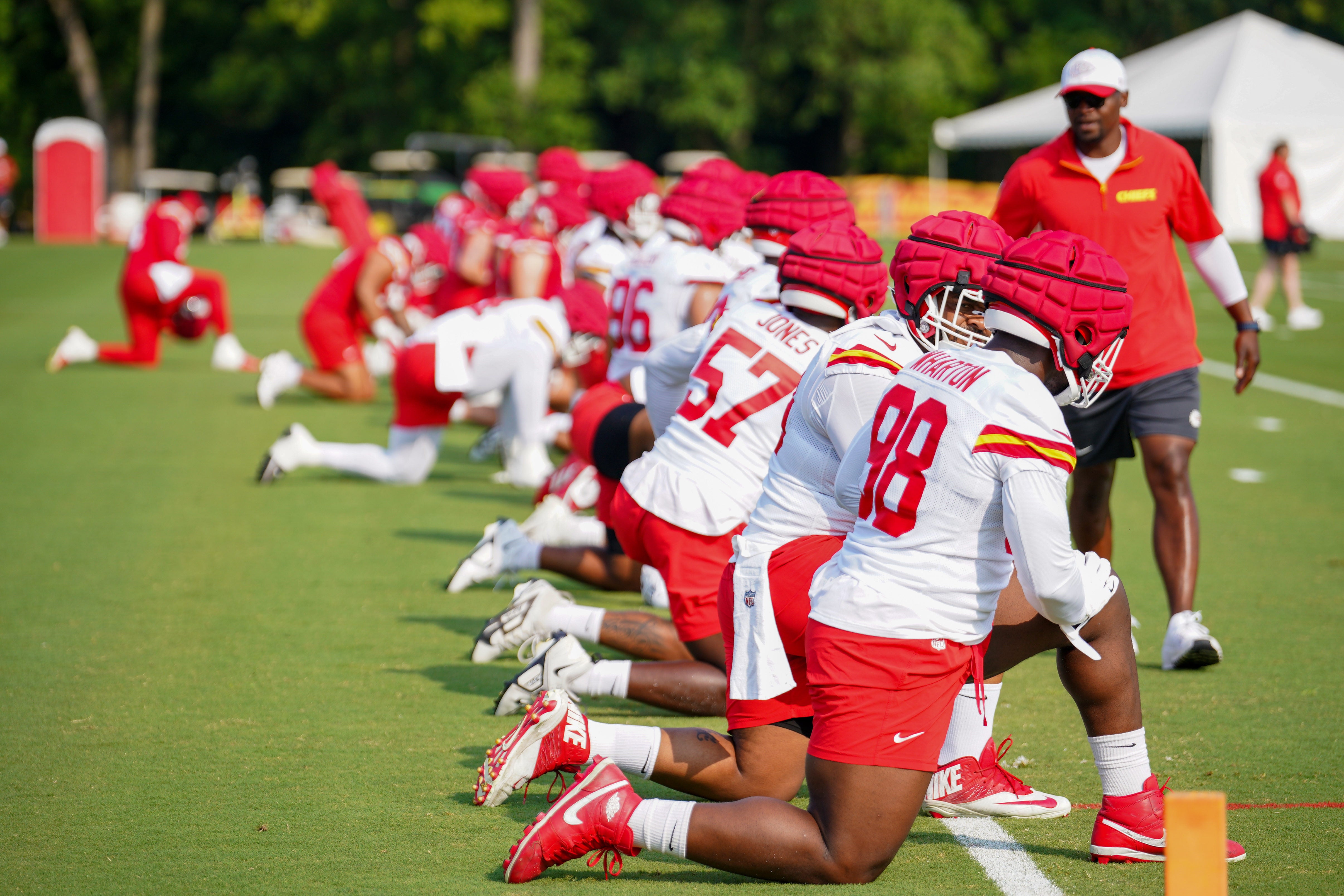 Jul 22, 2024; St. Joseph, MO, USA; Kansas City Chiefs players stretch out during training camp at Missouri Western State University.