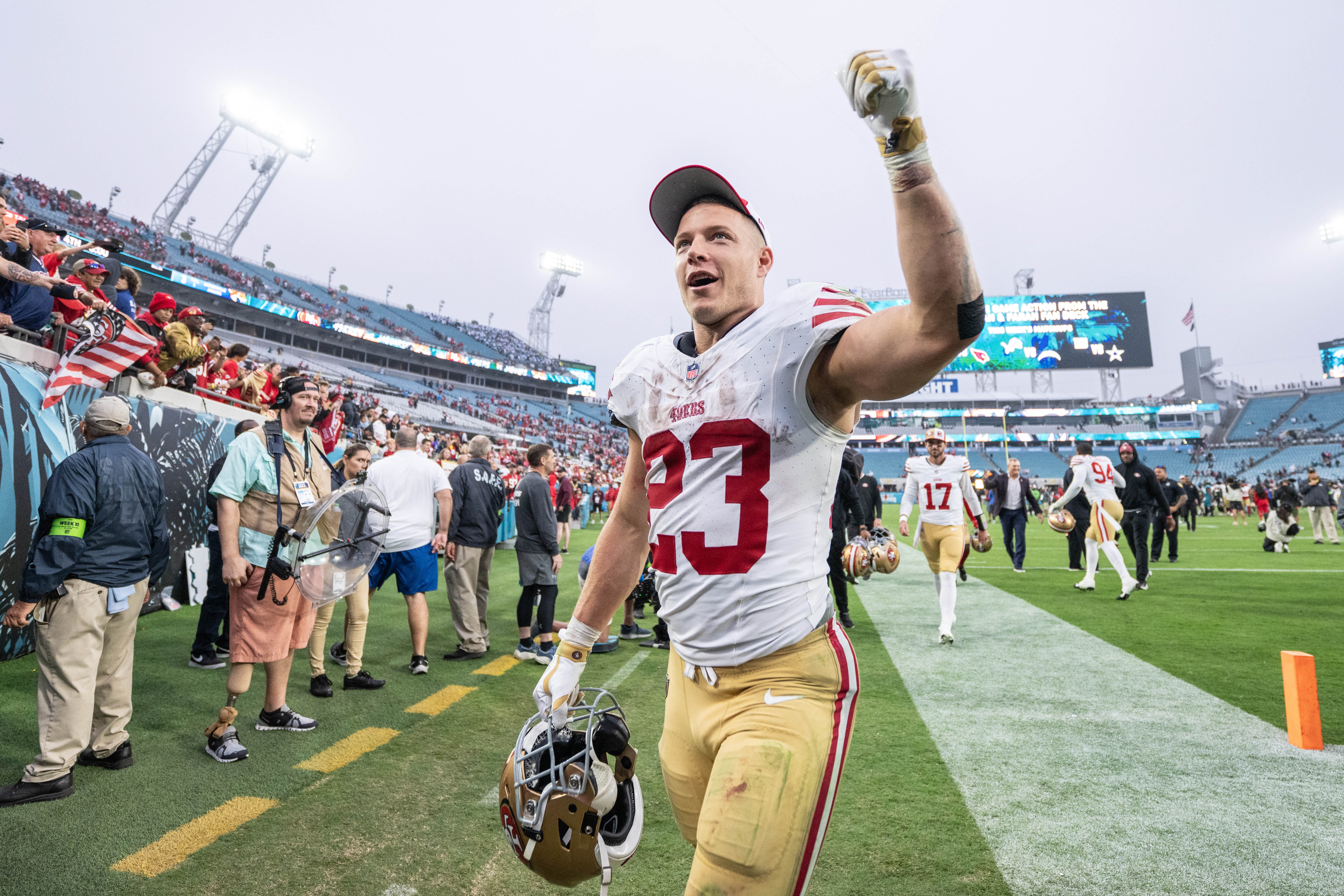 Nov 12, 2023; Jacksonville, Florida, USA; San Fransisco 49ers running back Christian McCaffrey (23) celebrates the win against the Jacksonville Jaguars after the game at EverBank Stadium.