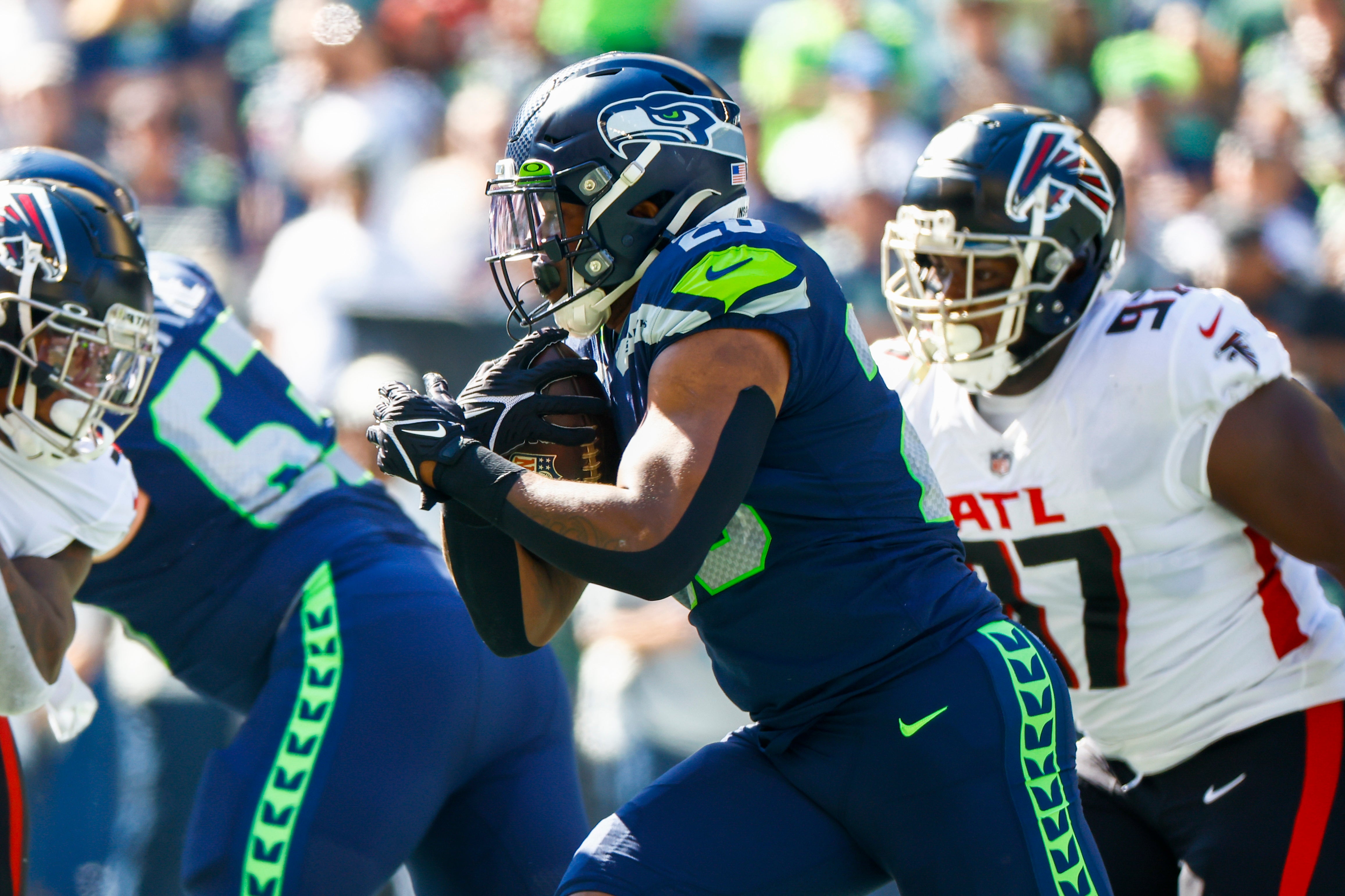 Sep 25, 2022; Seattle, Washington, USA; Seattle Seahawks running back Rashaad Penny (20) rushes against the Atlanta Falcons during the first quarter at Lumen Field.