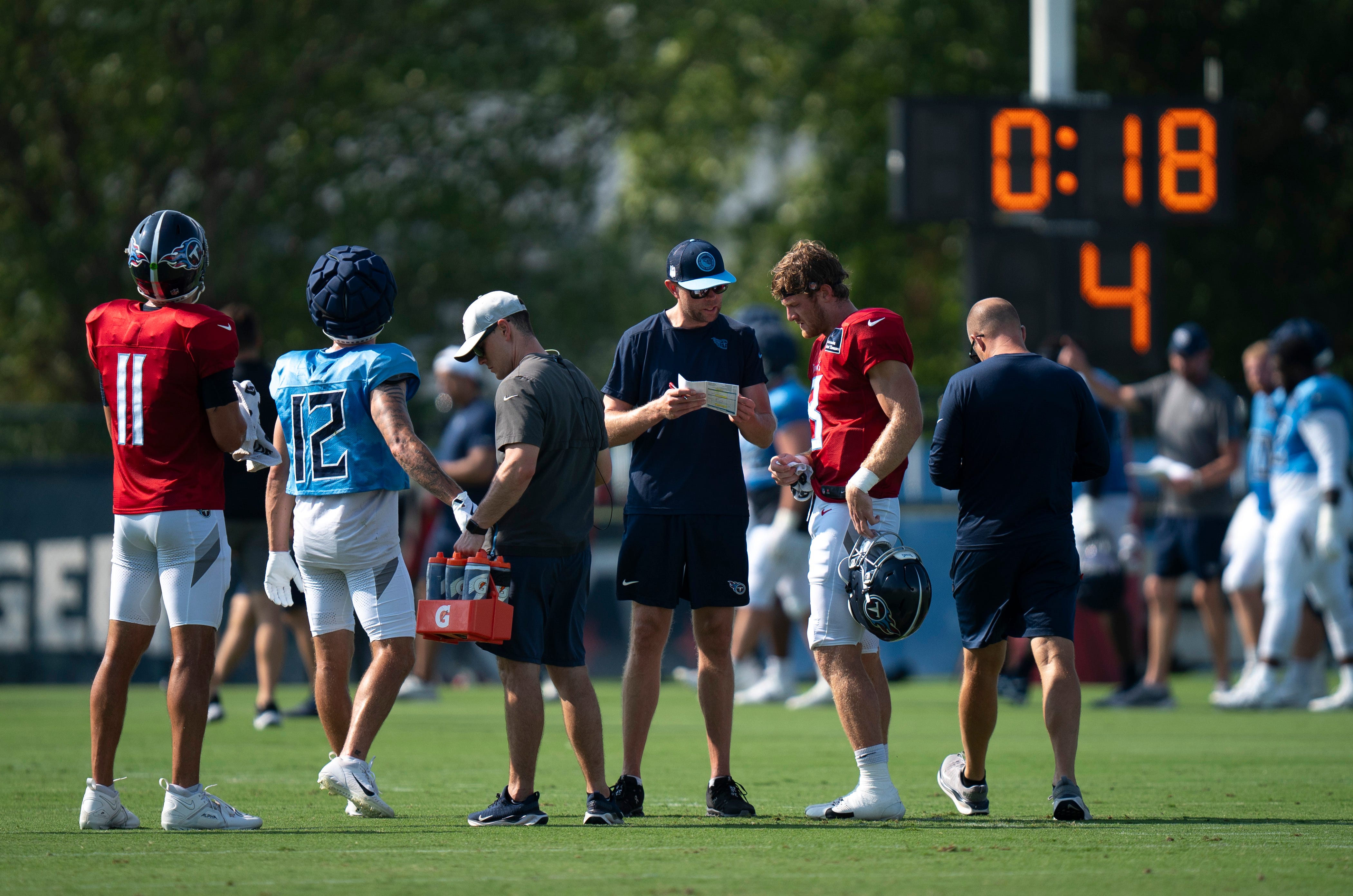 The Tennessee Titans offense takes a break between drills during the Tennessee Titans training camp at Ascension Saint Thomas Sports Park in Nashville, Tenn., Tuesday, July 30, 2024 Denny Simmons/The Tennessean-USA TODAY NETWORK