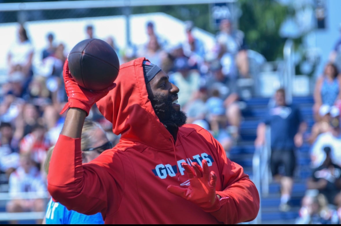 Matthew Judon throws the ball to fans