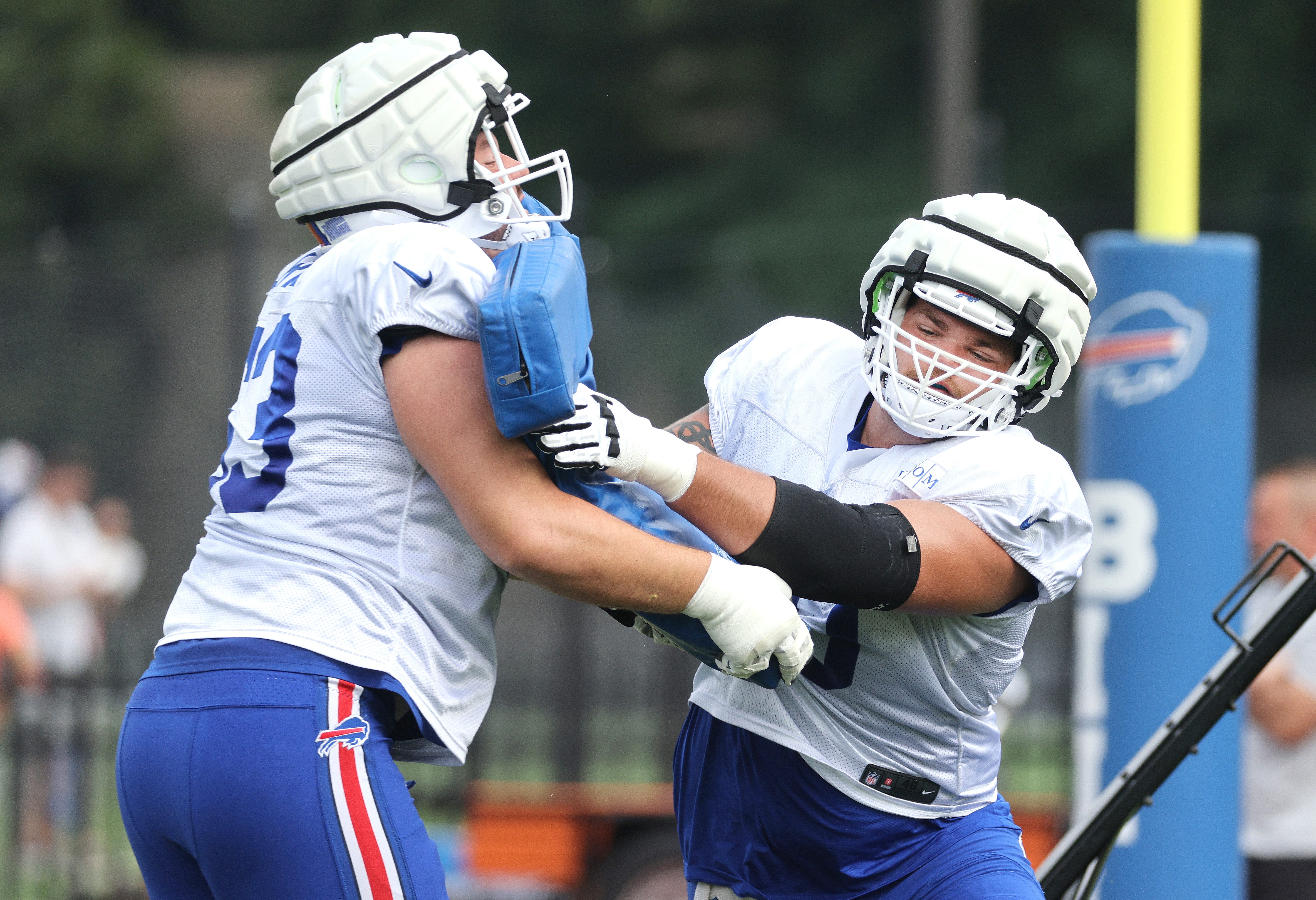 Offensive lineman Alec Anderson fights off a block during practice.