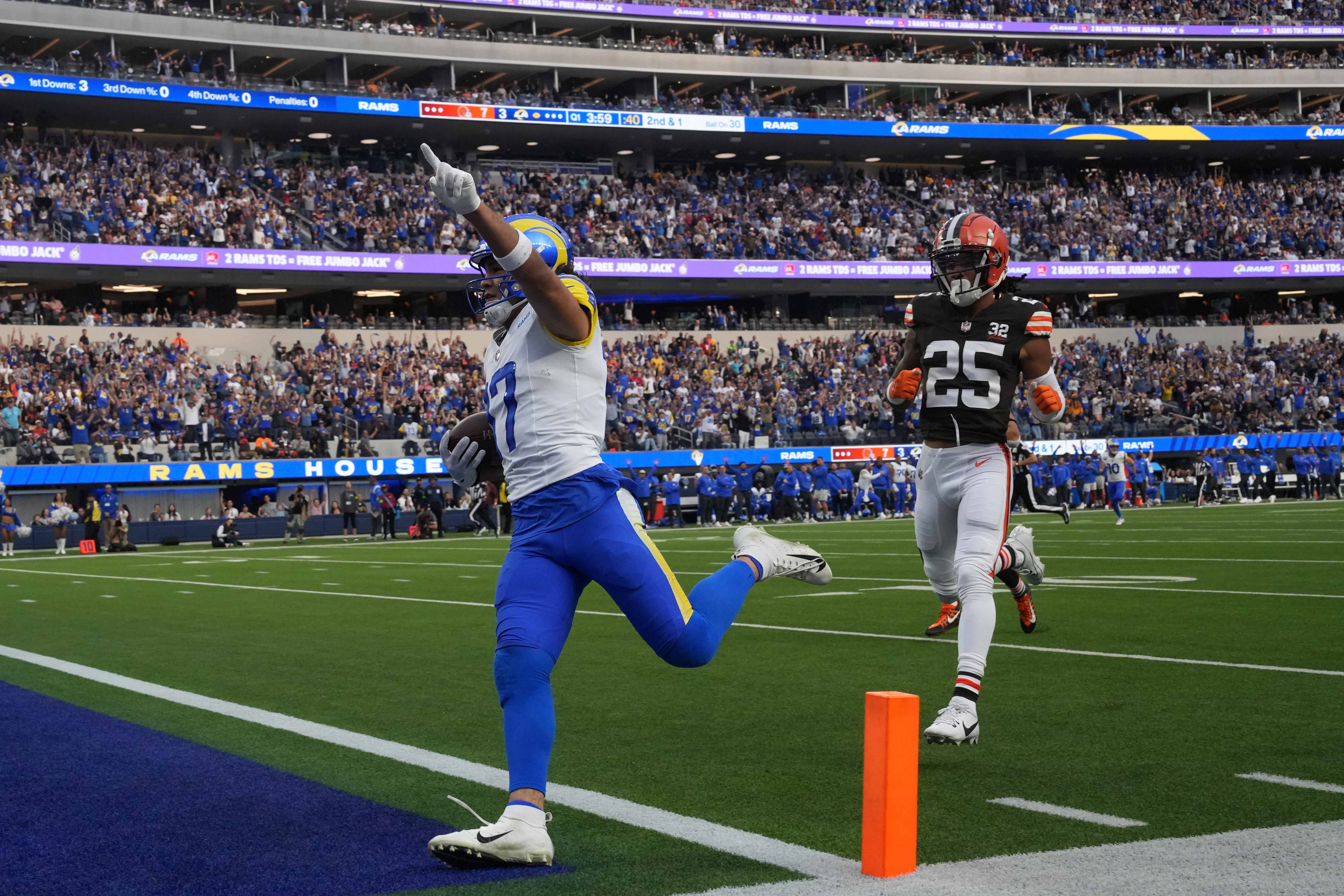 Dec 3, 2023; Inglewood, California, USA;Los Angeles Rams wide receiver Puka Nacua (17) scores on a 70-yard touchdown reception against Cleveland Browns cornerback Kahlef Hailassie (25) in the first half at SoFi Stadium. Mandatory Credit: Kirby Lee-USA TODAY Sports