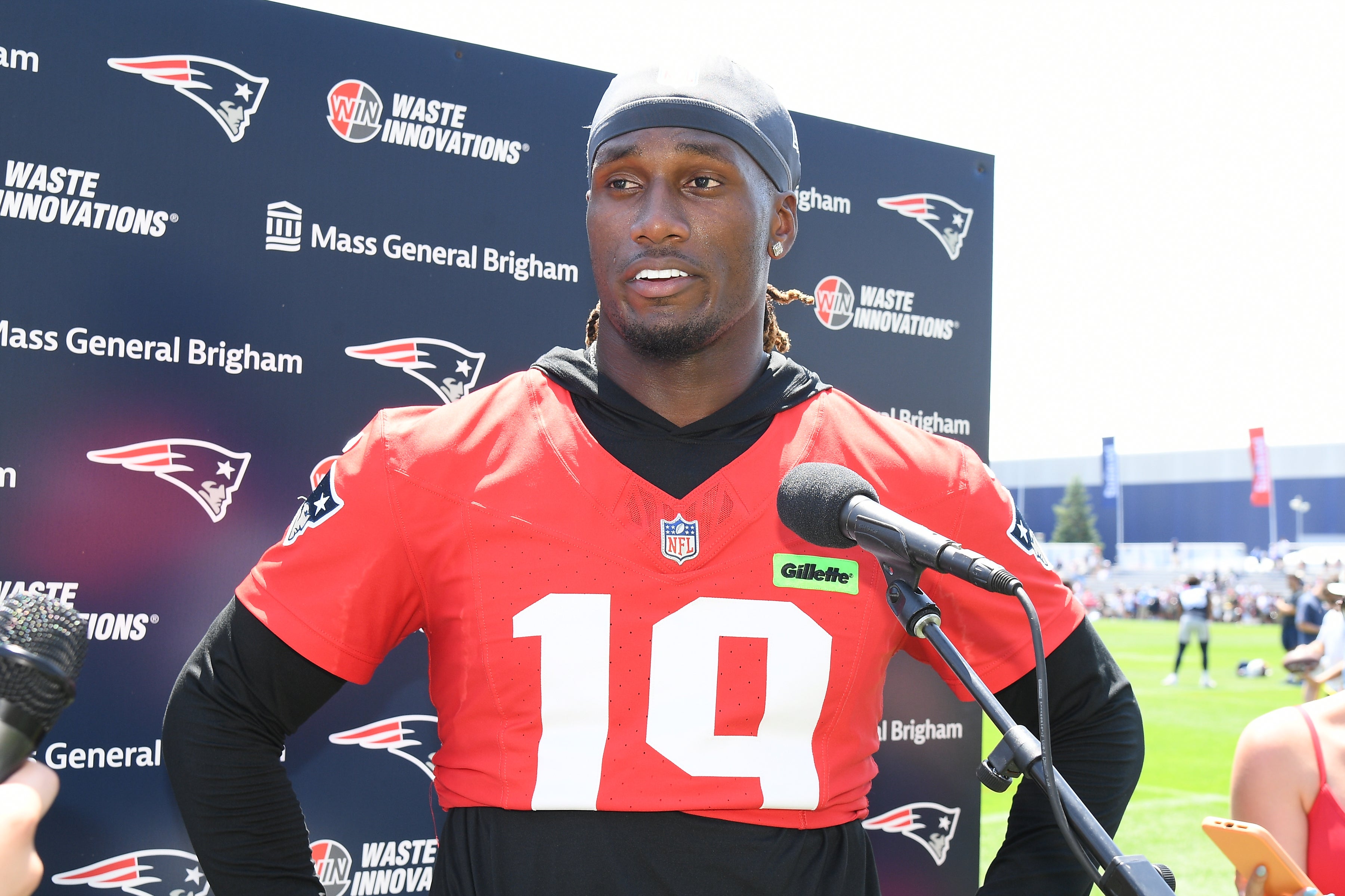 Caption: Jul 26, 2024; Foxborough, MA, USA; New England Patriots quarterback Joe Milton III (19) holds a press conference at training camp at Gillette Stadium.