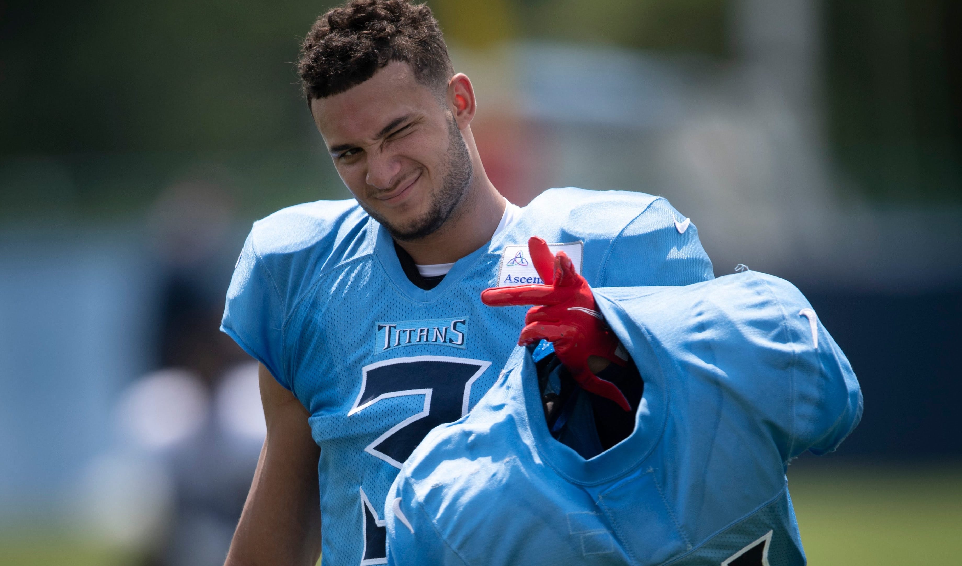 Tennessee Titans cornerback Caleb Farley (3), the Titans first-round draft pick in 2021, carries veteran players' shoulder pads after a training camp practice at Saint Thomas Sports Park Monday, Aug. ... George Walker IV / Tennessean.com-USA TODAY NETWORK