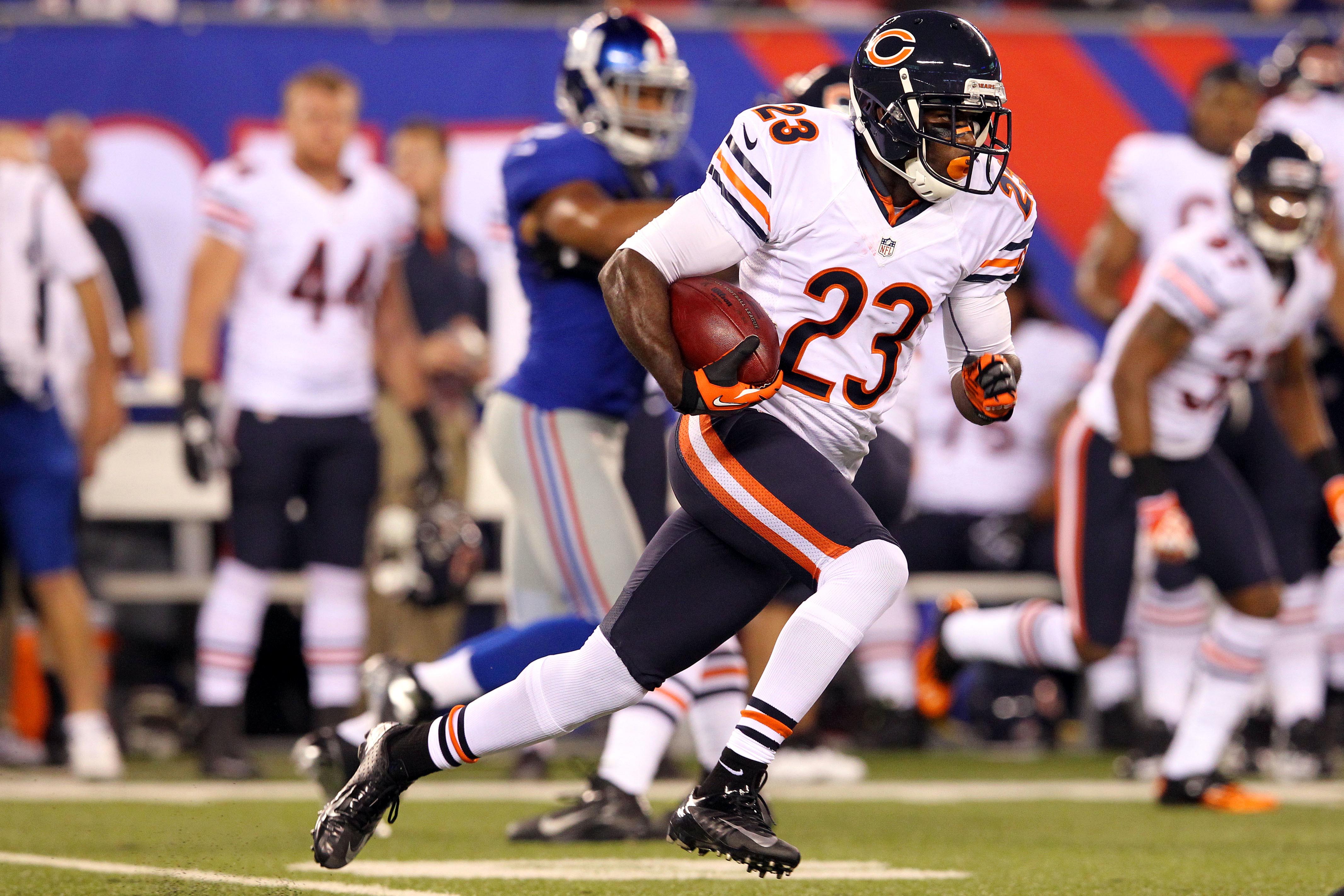 August 24, 2012; East Rutherford, NJ, USA; Chicago Bears wide receiver Devin Hester (23) runs with the ball during the first quarter of a preseason NFL game against the New York Giants at MetLife Stadium.