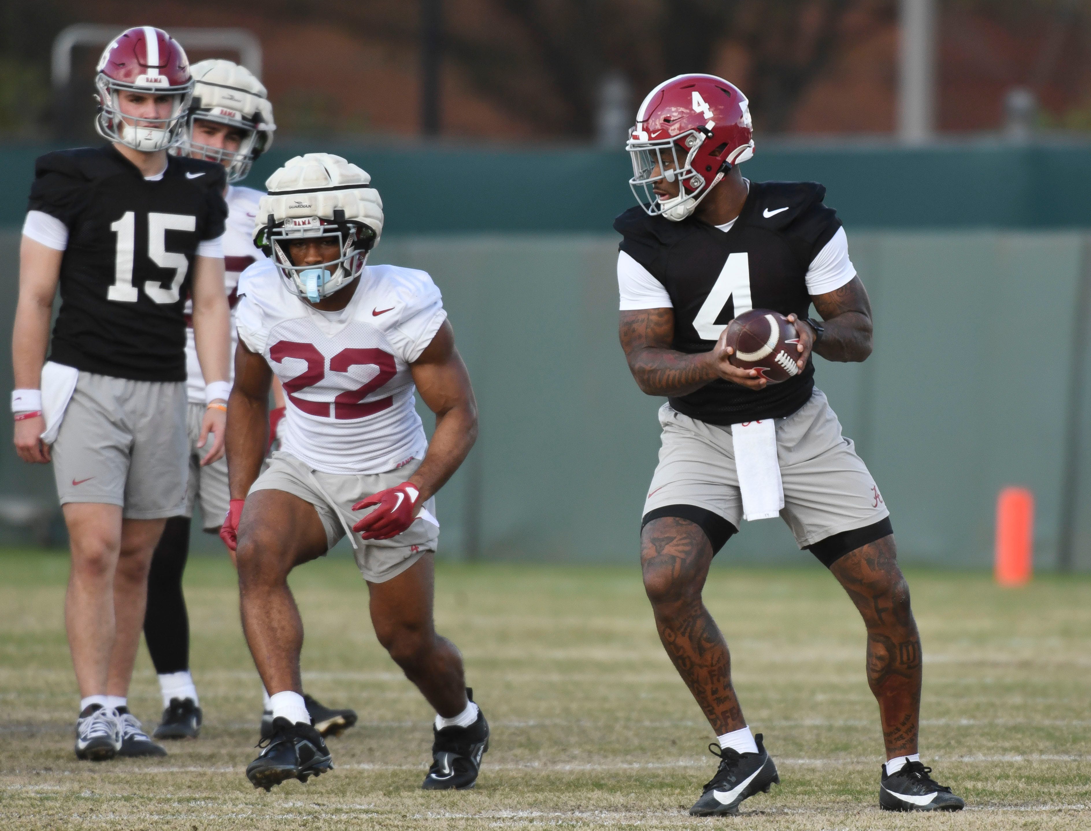 Mar 6, 2024; Tuscaloosa, Alabama, USA; Jalen Milroe turns to hand the ball off to Justice Haynes during practice for the Alabama Crimson Tide football team Wednesday.