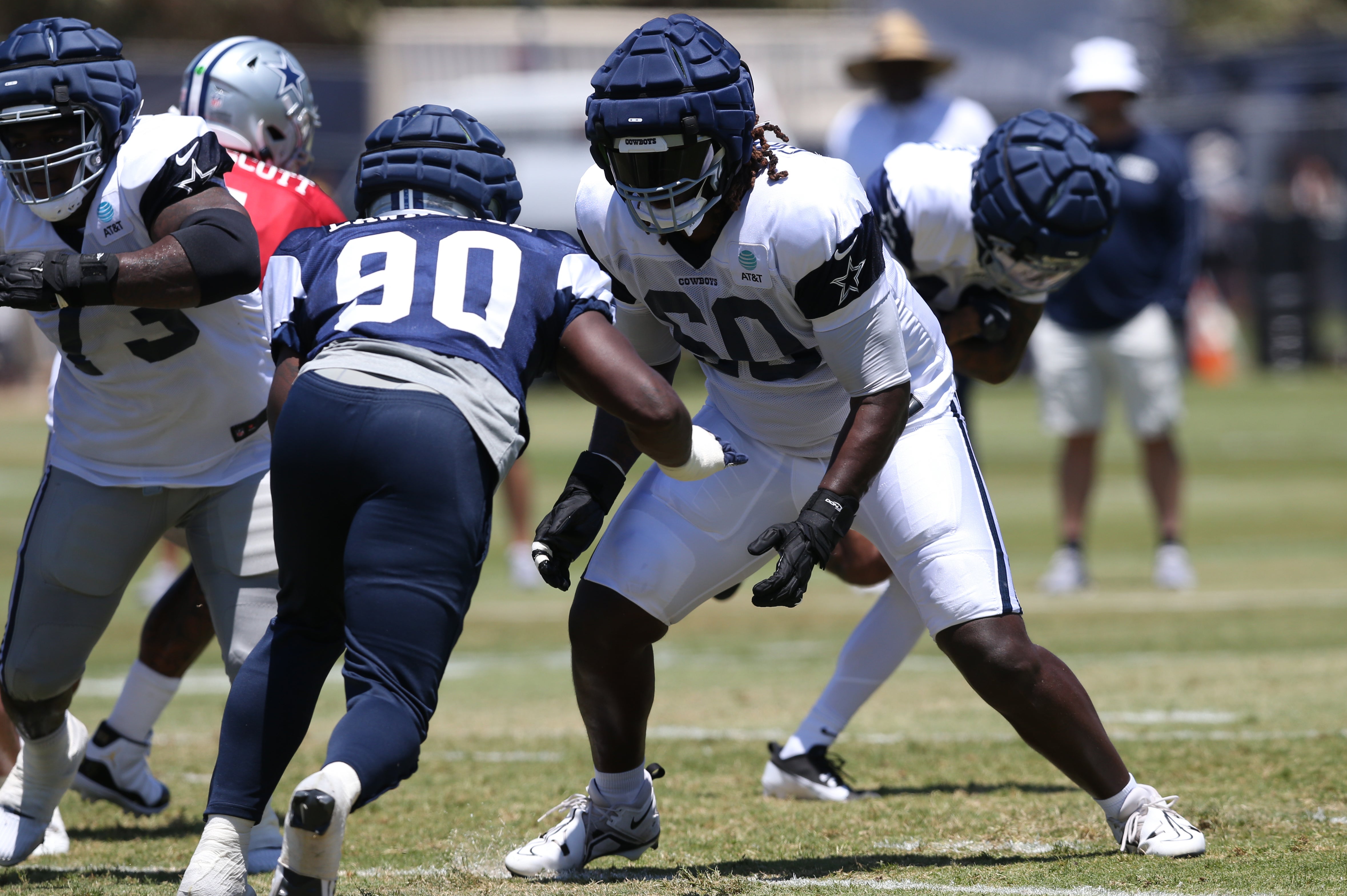 Dallas Cowboys offensive tackle Tyler Guyton (60) blocks during training camp at the River Ridge Playing Fields in Oxnard, California.