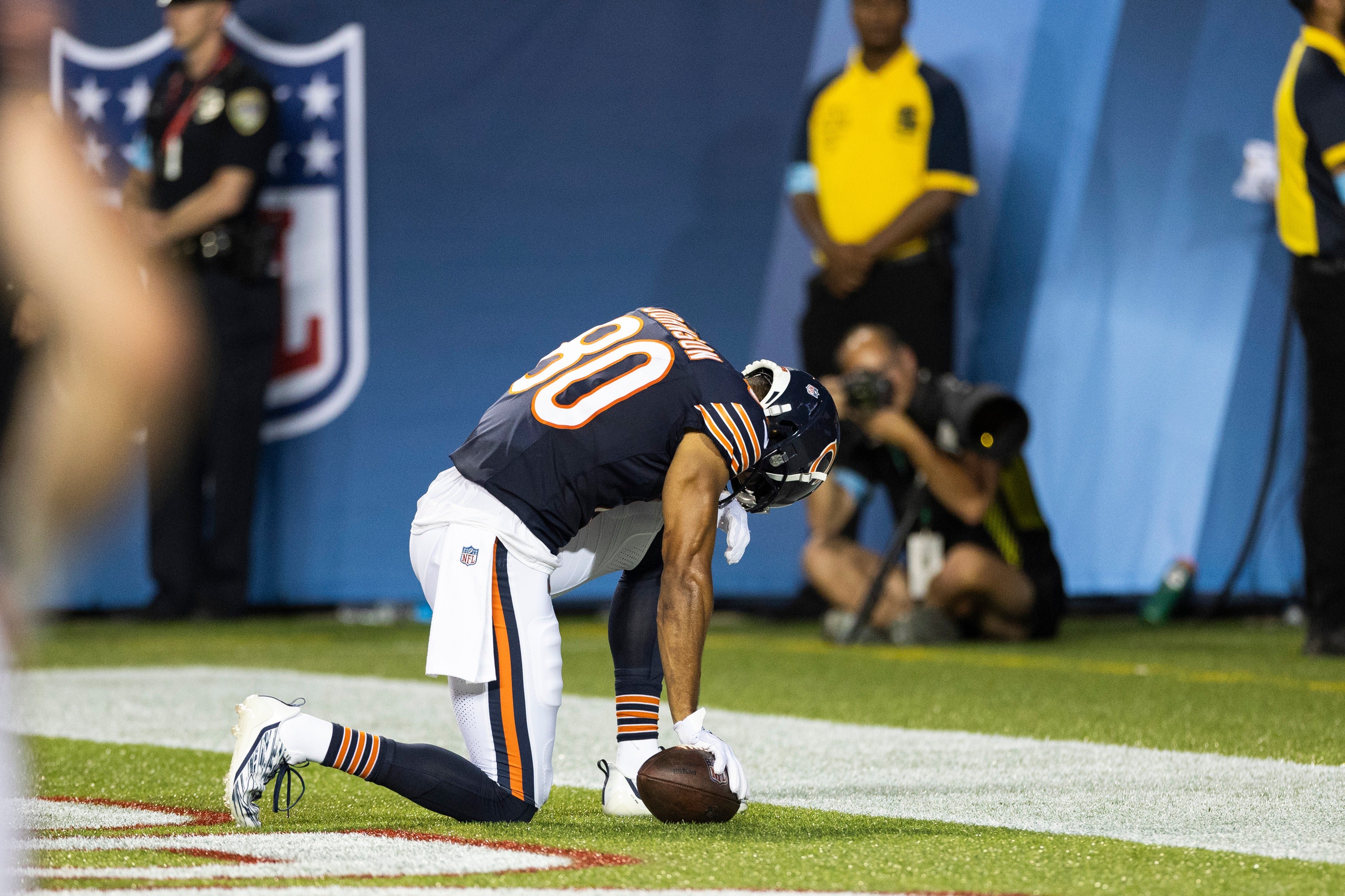 Aug 1, 2024; Canton, Ohio, USA; Chicago Bears wide receiver Collin Johnson (80) kneels following a touchdown against the Houston Texans during the second quarter at Tom Benson Hall of Fame Stadium.