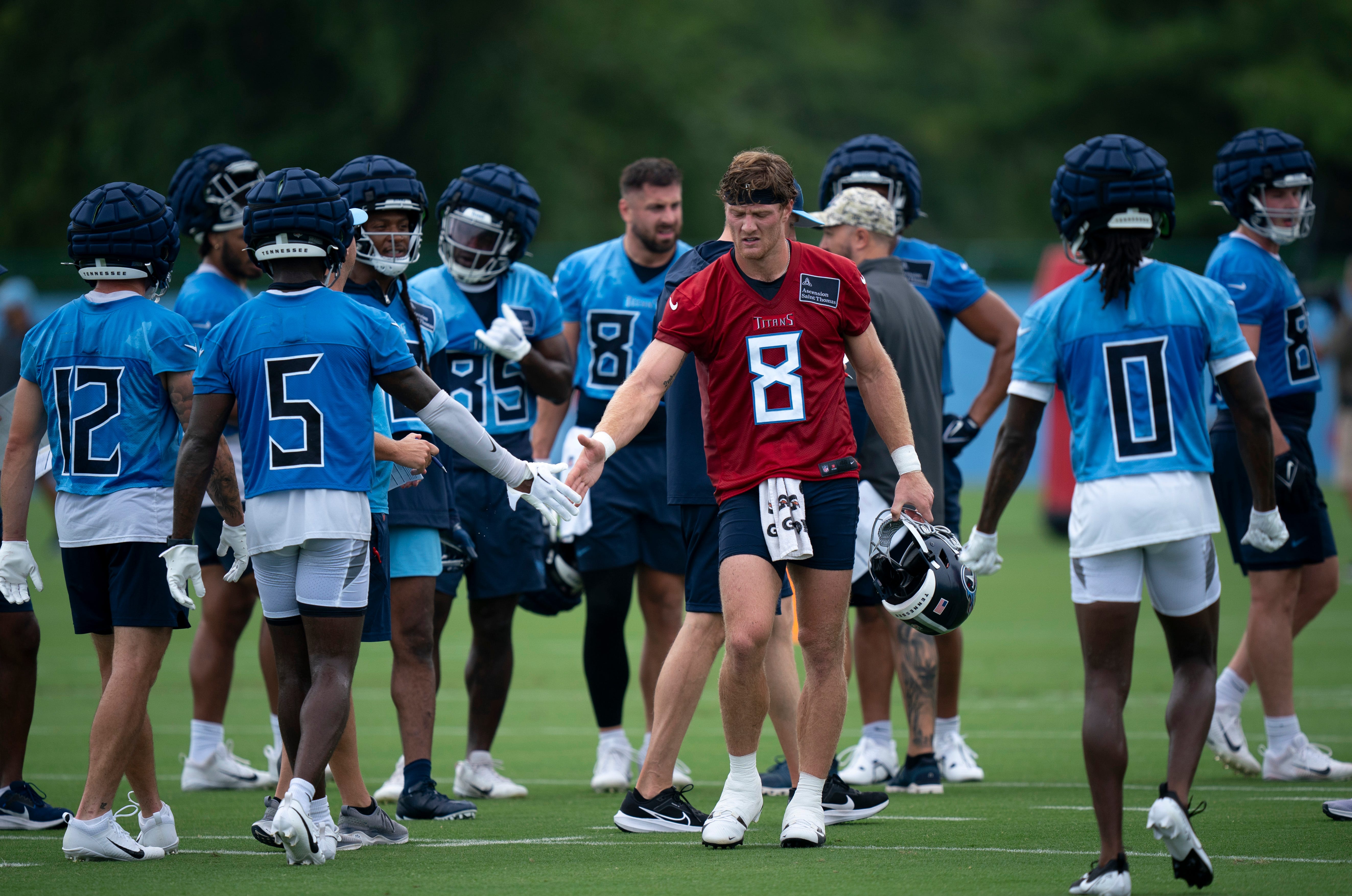 Tennessee Titans quarterback Will Levis (8) congratulates his teammates after running a set of drills on the first day of training camp at Ascension Saint Thomas Sports Park Wednesday, July 24, 2024 Denny Simmons/The Tennessean-USA TODAY NETWORK