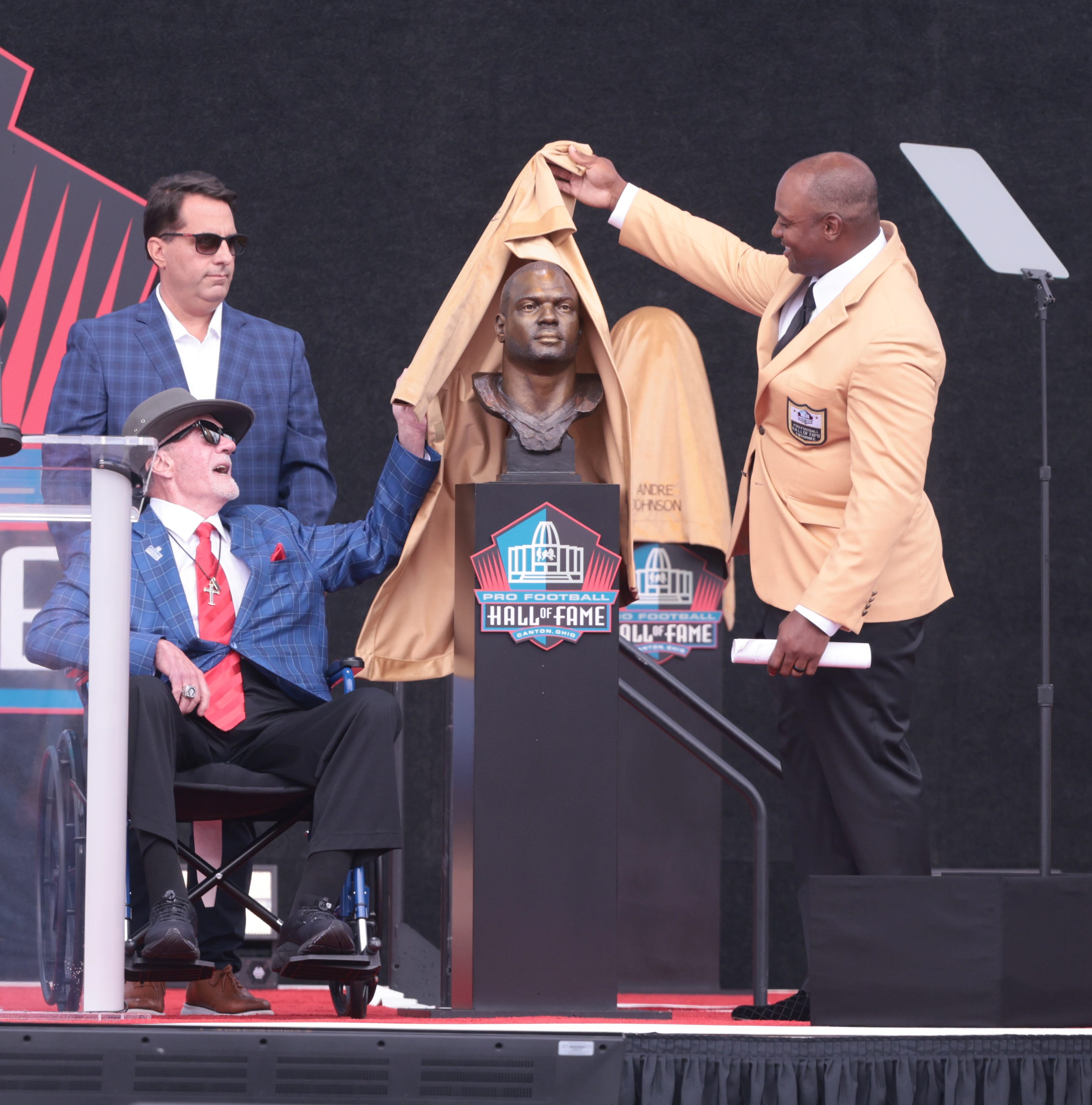 Indianapolis Colt's owner & CEO Jim Irsay helps Dwight Freeney unveil his bust during his Pro Football Hall of Fame induction on Saturday, Aug. 3, 2024, in Canton, Ohio, at Tom Benson Hall of Fame Stadium.
