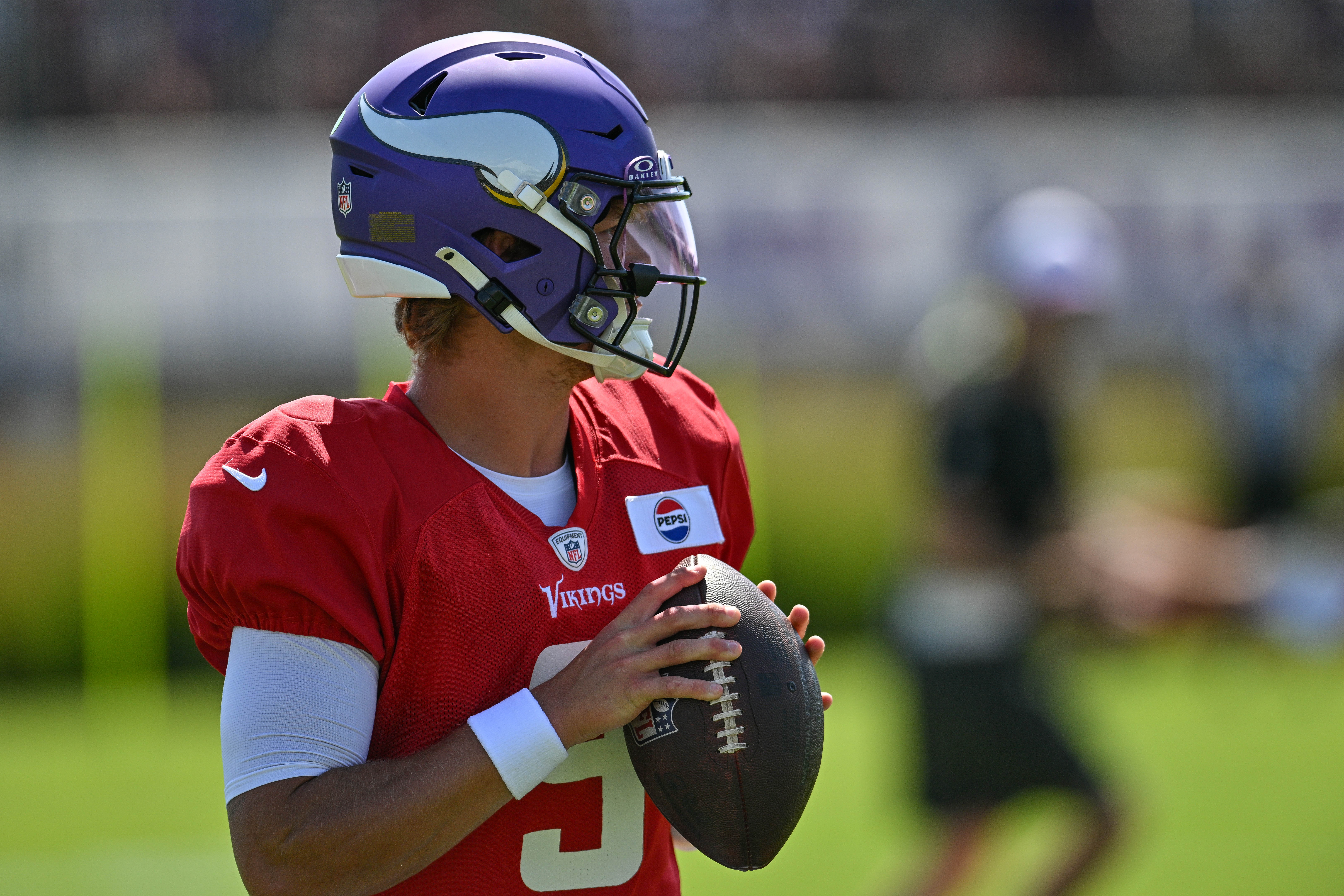 Aug 2, 2024; Eagan, MN, USA; Minnesota Vikings quarterback J.J. McCarthy (9) warms up during practice at Vikings training camp in Eagan, MN.