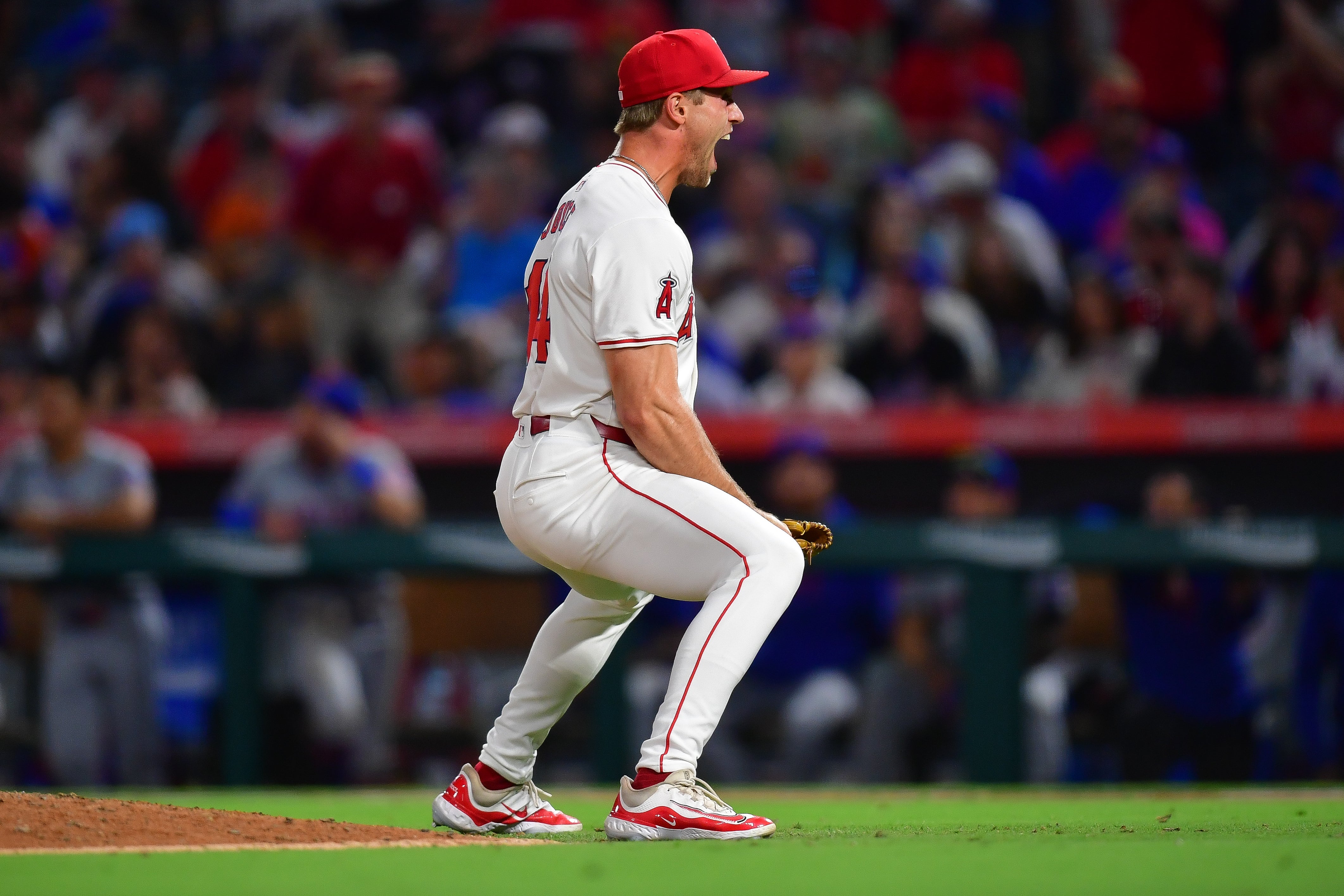 August 3, 2024; Anaheim, California, USA; Los Angeles Angels pitcher Ben Joyce (44) reacts after striking out New York Mets designated hitter J.D. Martinez (28) during the ninth inning at Angel Stadium.