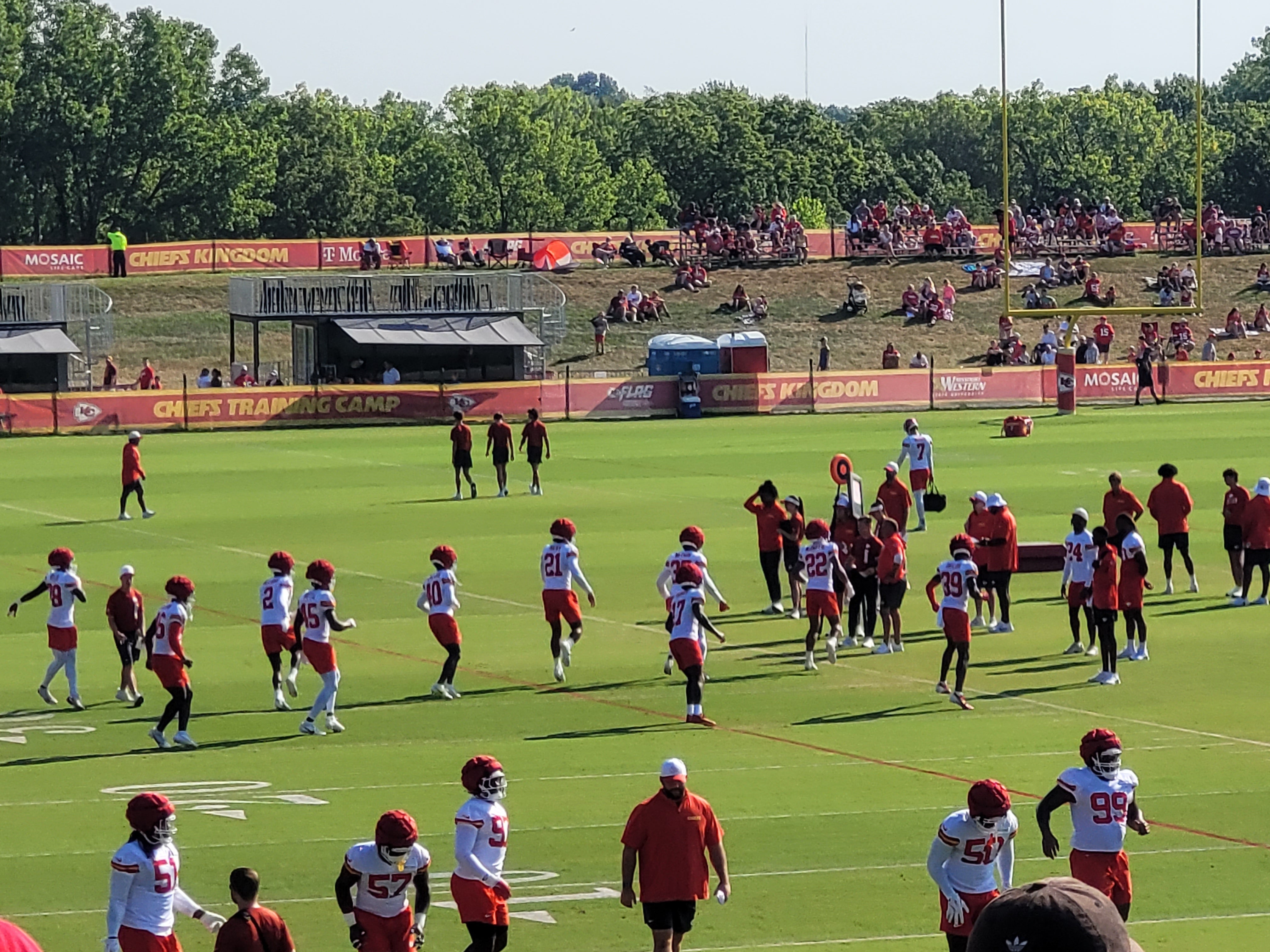 Chiefs players warm up ahead of practice on Sunday.