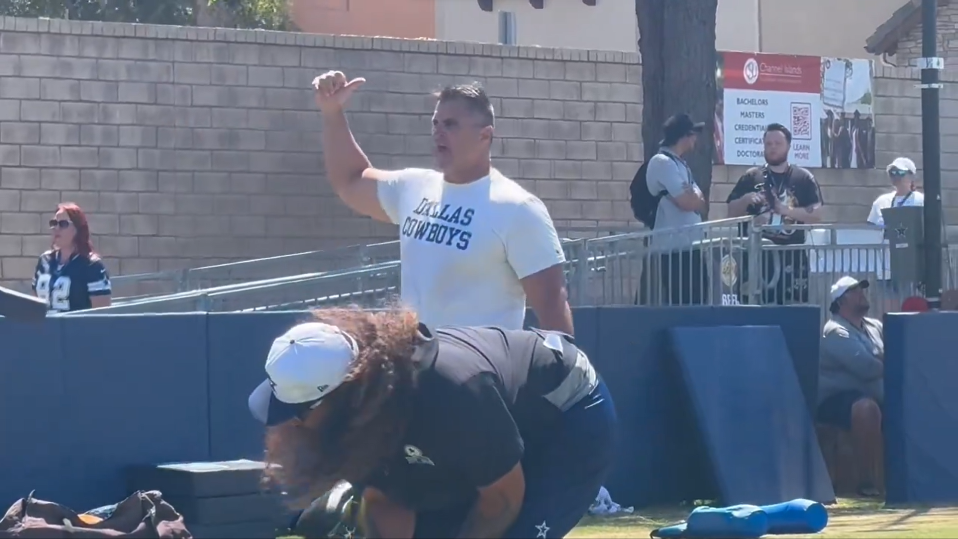 Dallas Cowboys defensive line coach Jeff Zgonina coaches Mazi Smith hard in 2024 training camp.