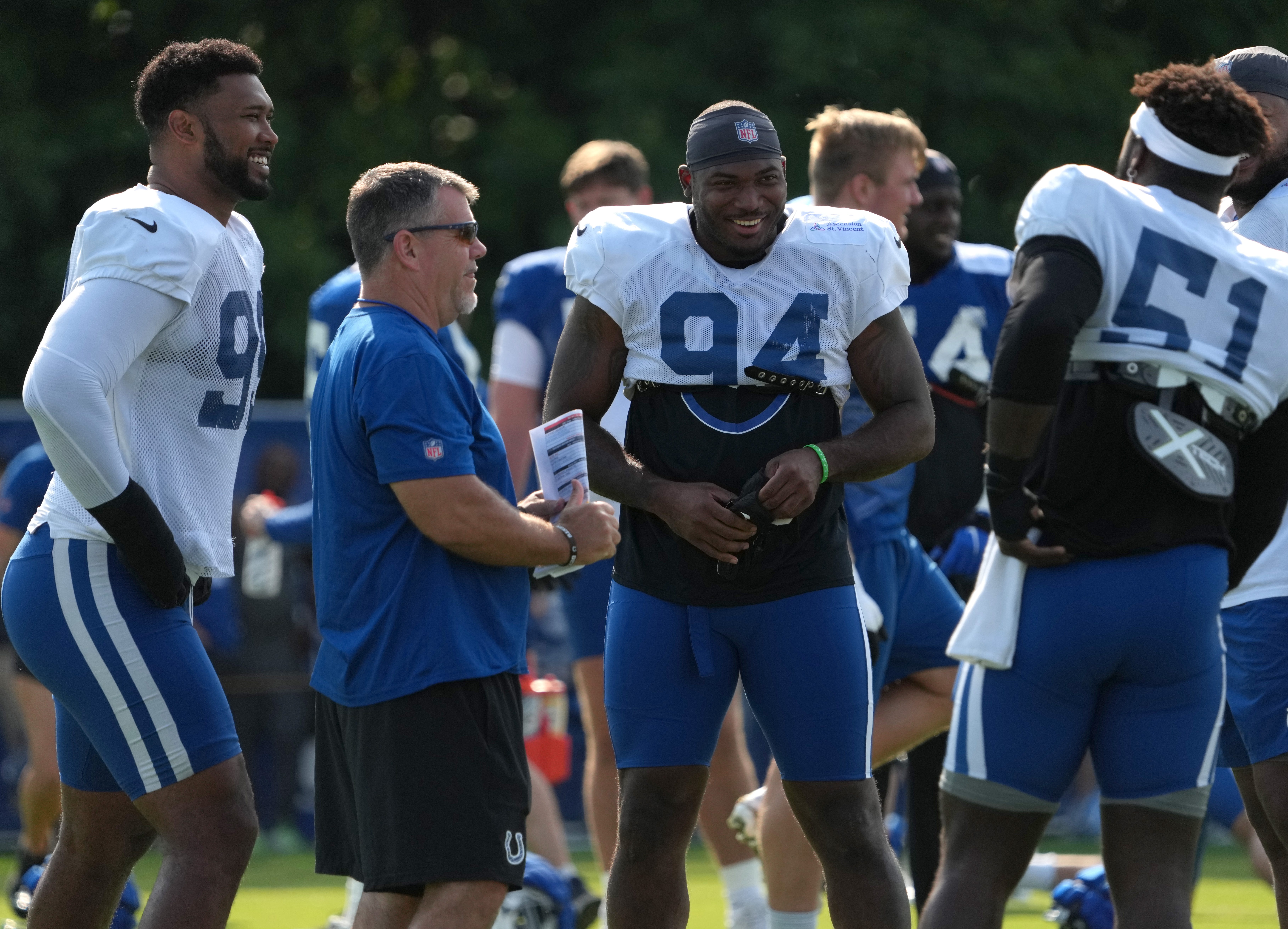 Indianapolis Colts defensive tackle DeForest Buckner (99), defensive end Tyquan Lewis (94) and defensive end Kwity Paye (51) share a laugh during the Colts’ training camp Wednesday, July 31, 2024, at Grand Park Sports Complex in Westfield.