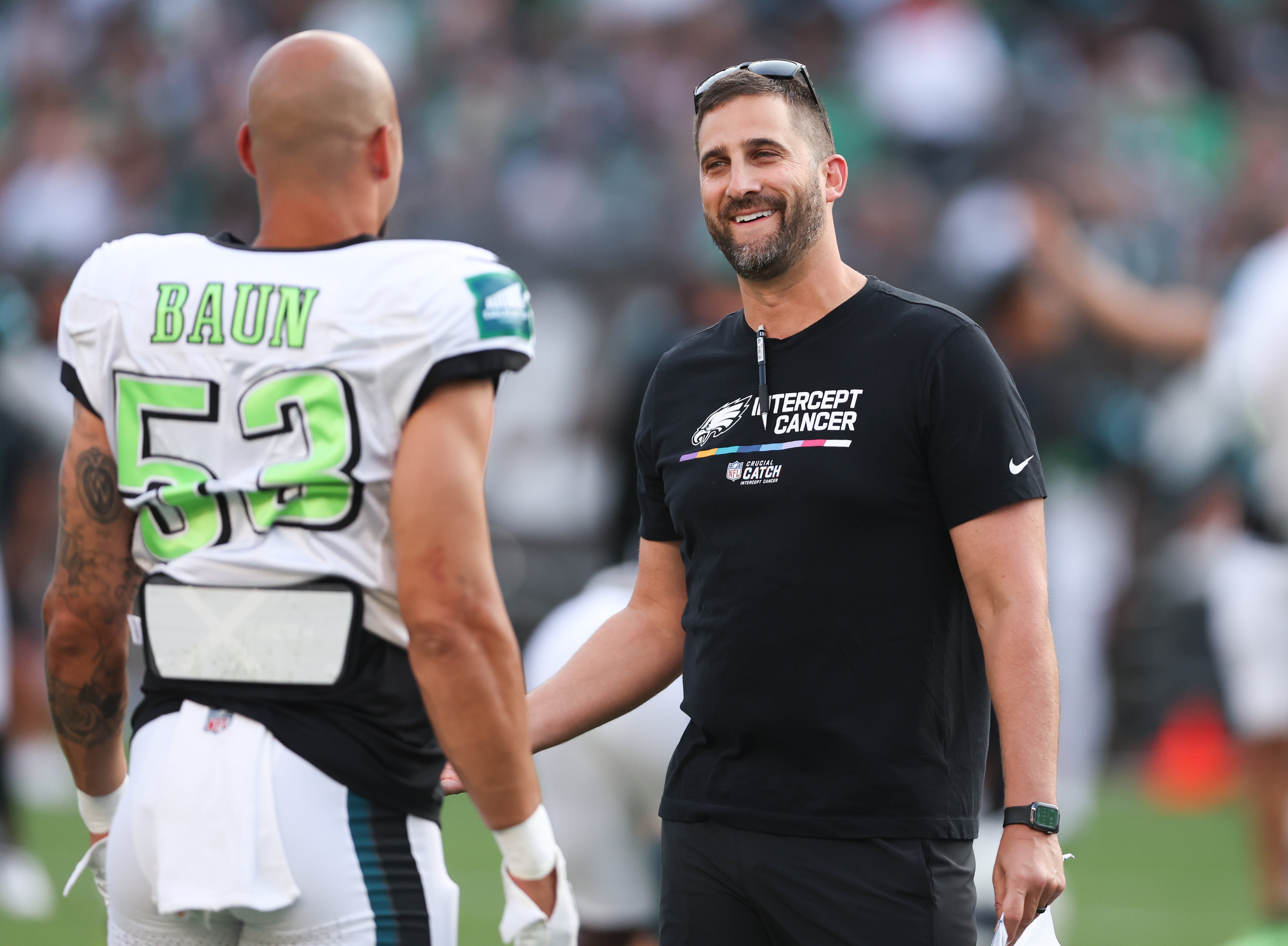 Philadelphia Eagles head coach Nick Sirianni talks with Philadelphia Eagles linebacker Zack Baun (53) during a training camp practice at Lincoln Financial Field.