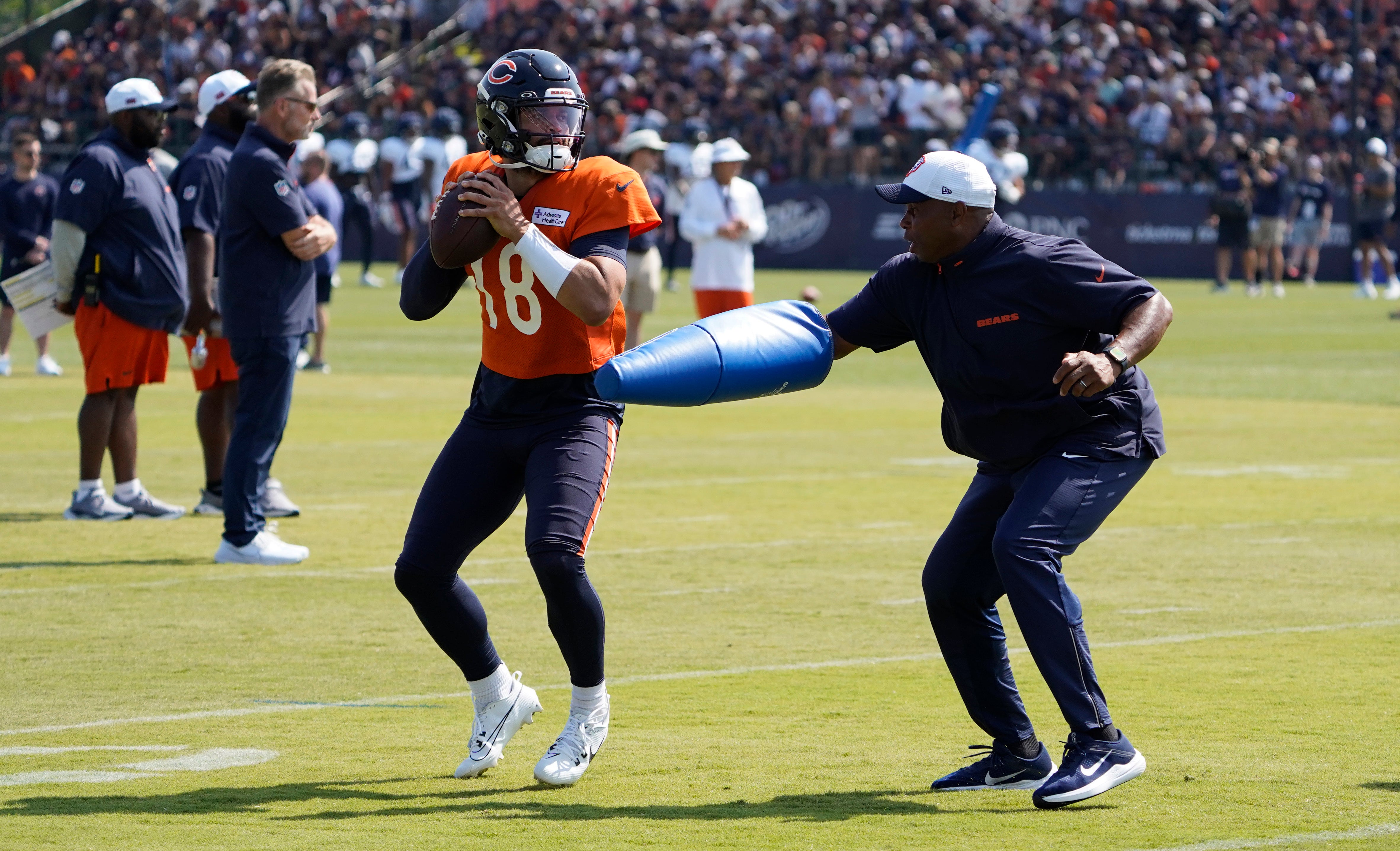 Jul 27, 2024; Lake Forest, IL, USA; Chicago Bears quarterback Caleb Williams (18) throws a pass during Chicago Bears Training Camp at Halas Hall.